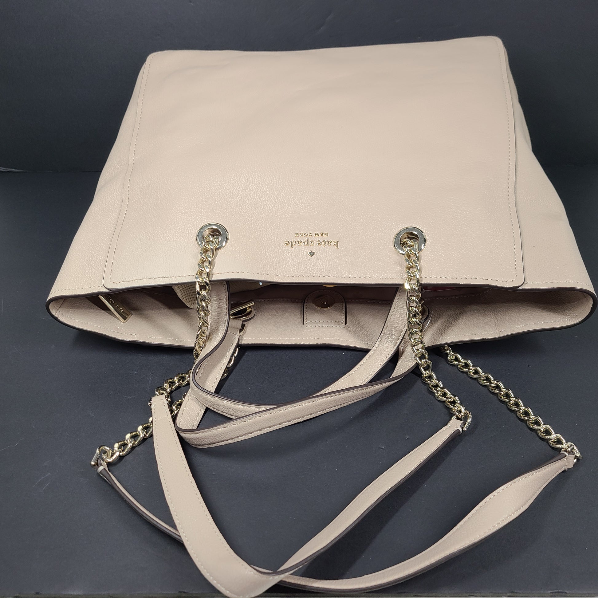 Beige Kate Spade leather tote with chain handles and gold hardware