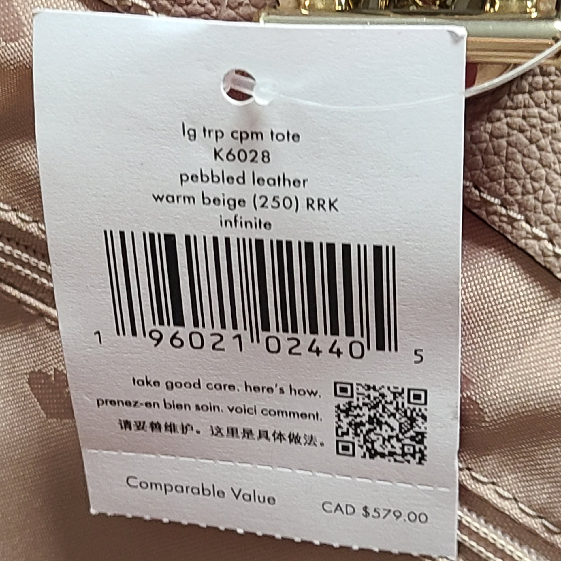 Beige Kate Spade leather tote with chain handles and gold hardware