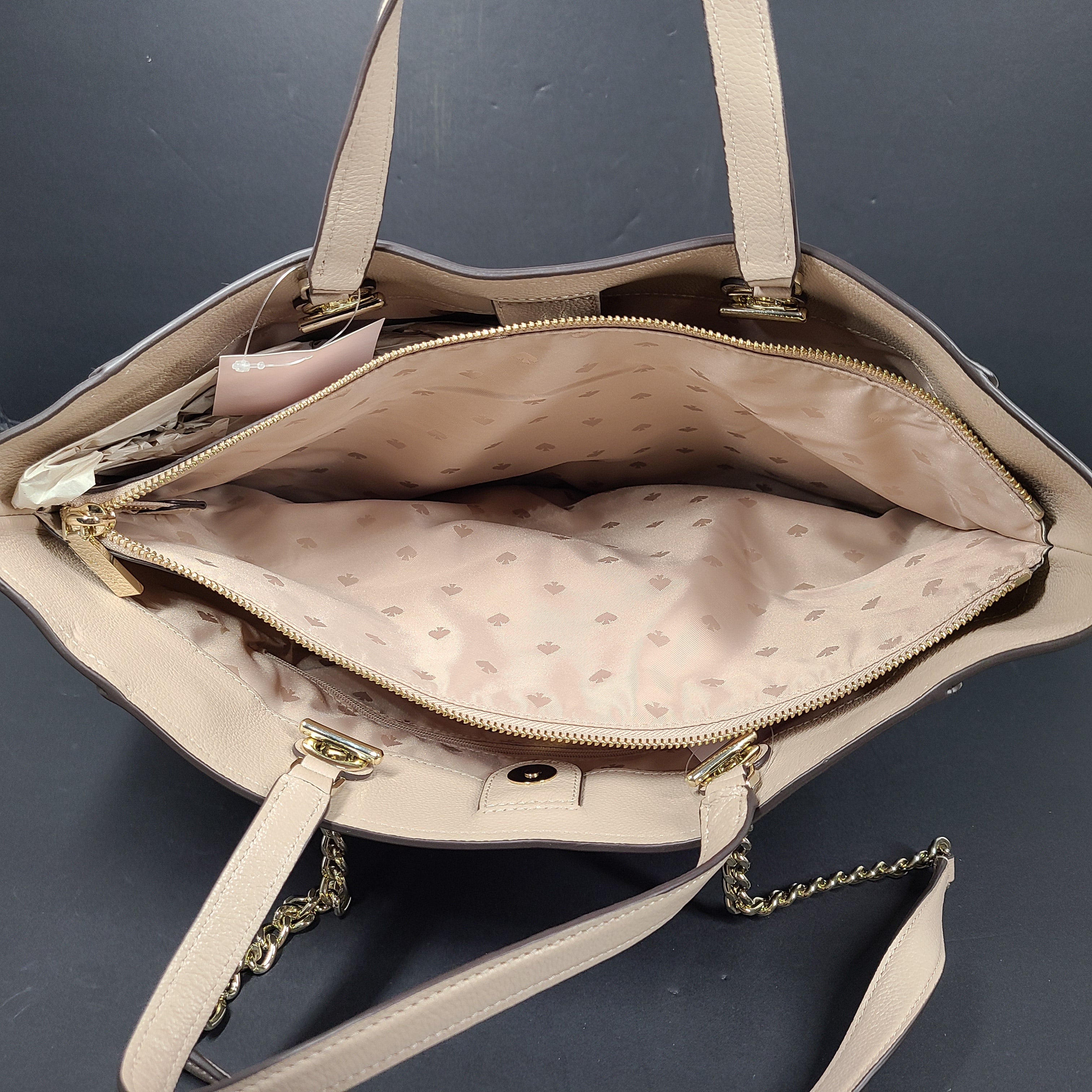 Beige Kate Spade leather tote with chain handles and gold hardware