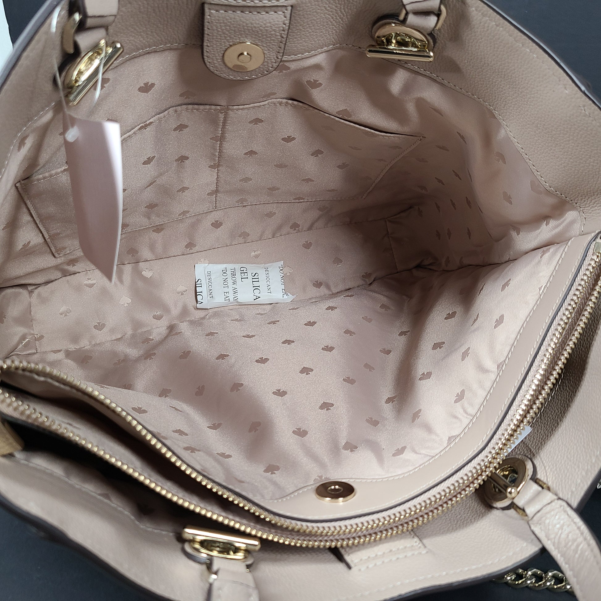 Beige Kate Spade leather tote with chain handles and gold hardware