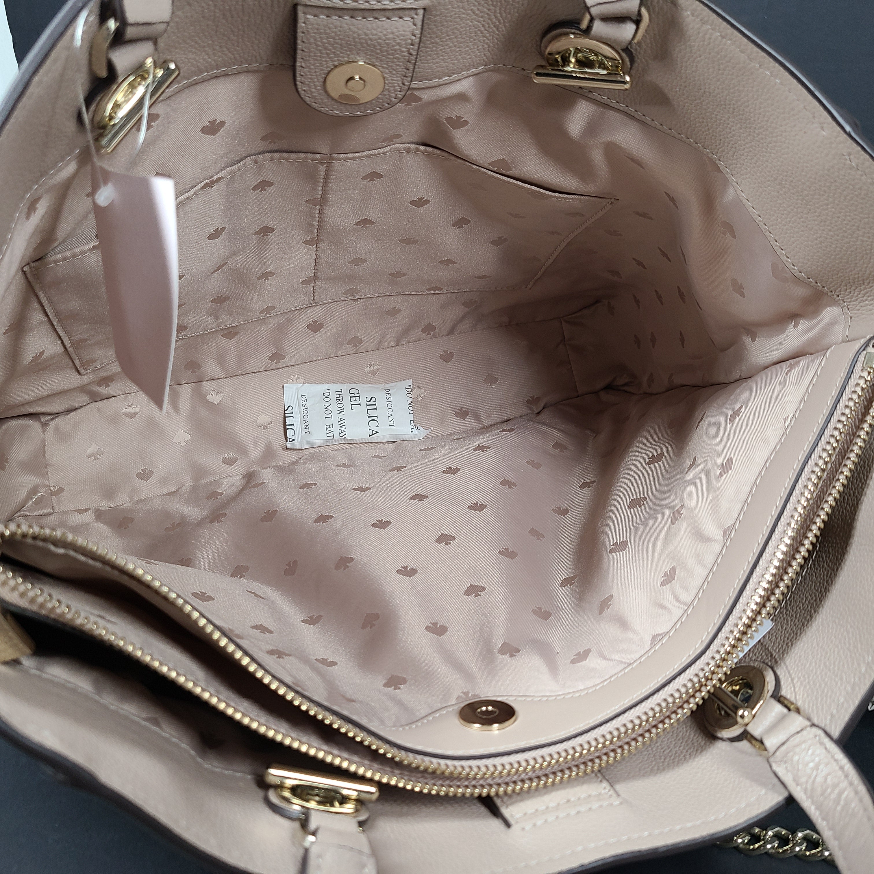 Beige Kate Spade leather tote with chain handles and gold hardware