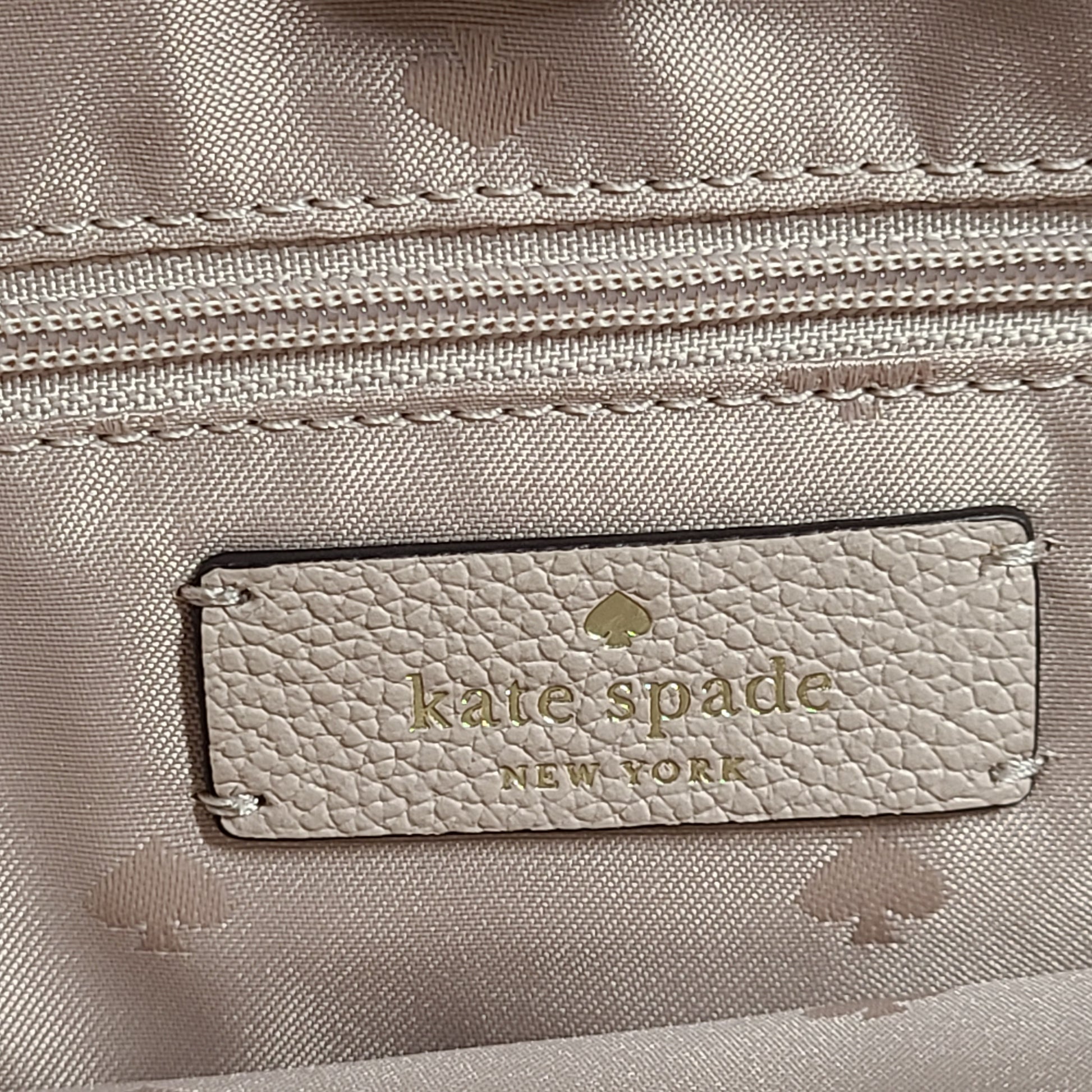 Beige Kate Spade leather tote with chain handles and gold hardware