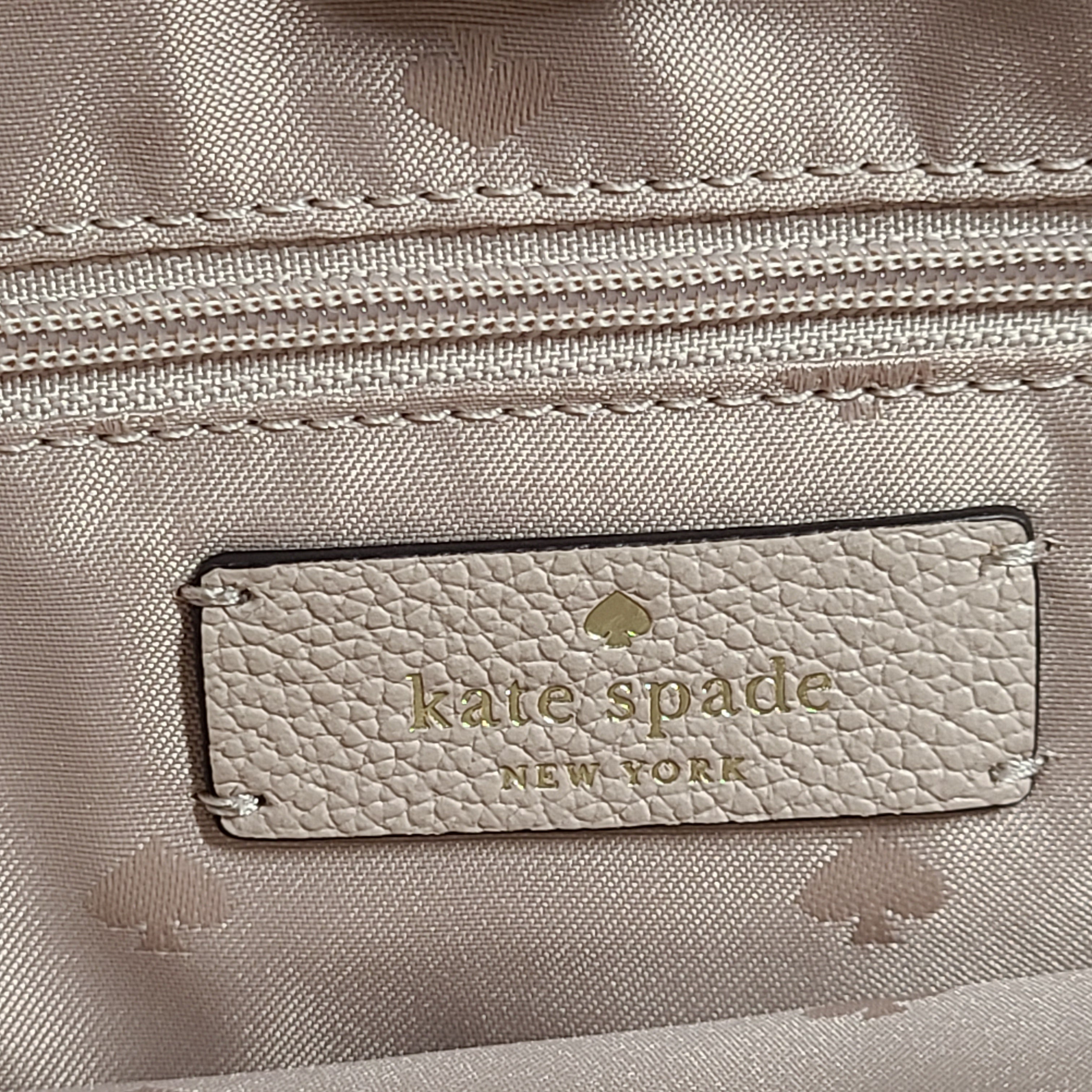 Beige Kate Spade leather tote with chain handles and gold hardware