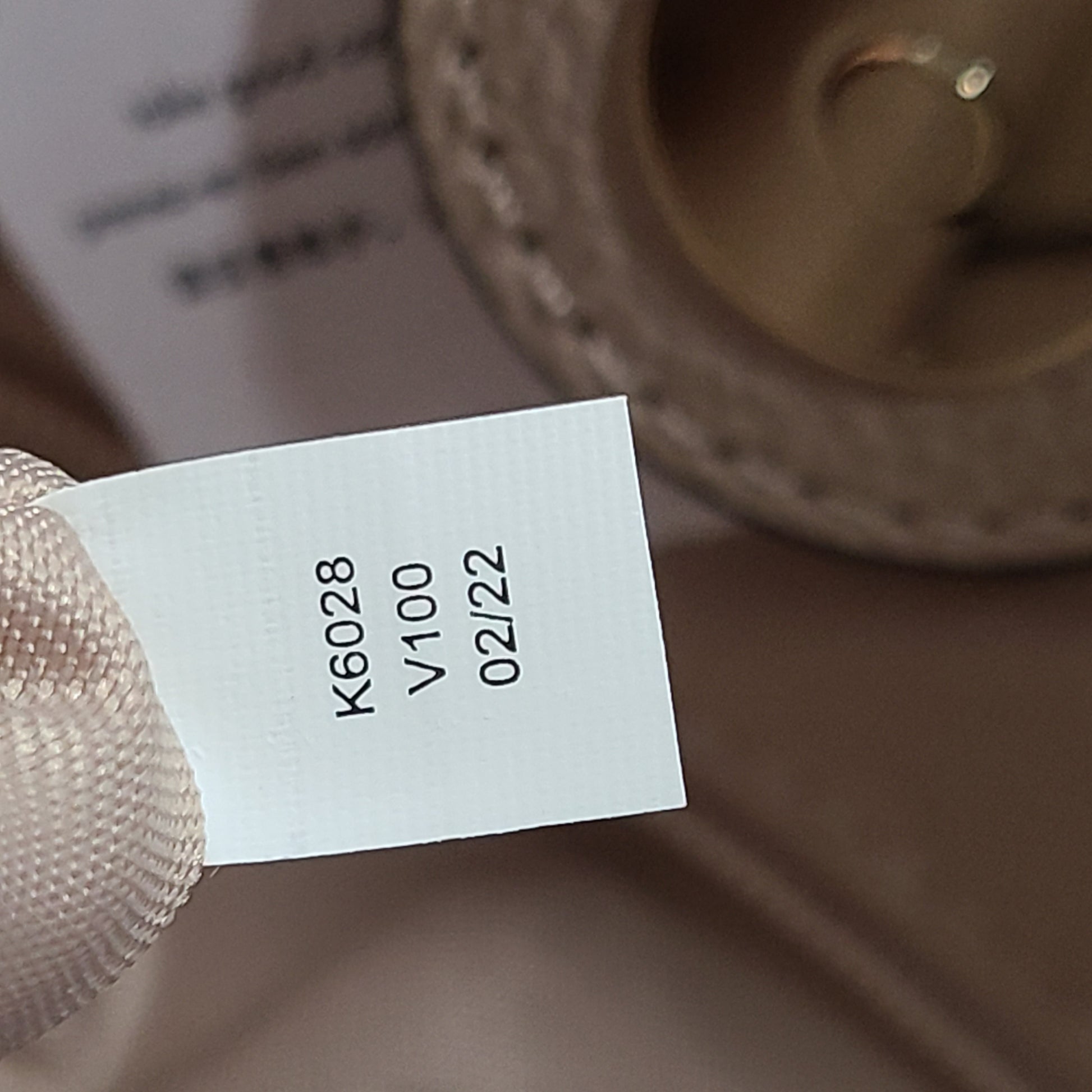 Beige Kate Spade leather tote with chain handles and gold hardware