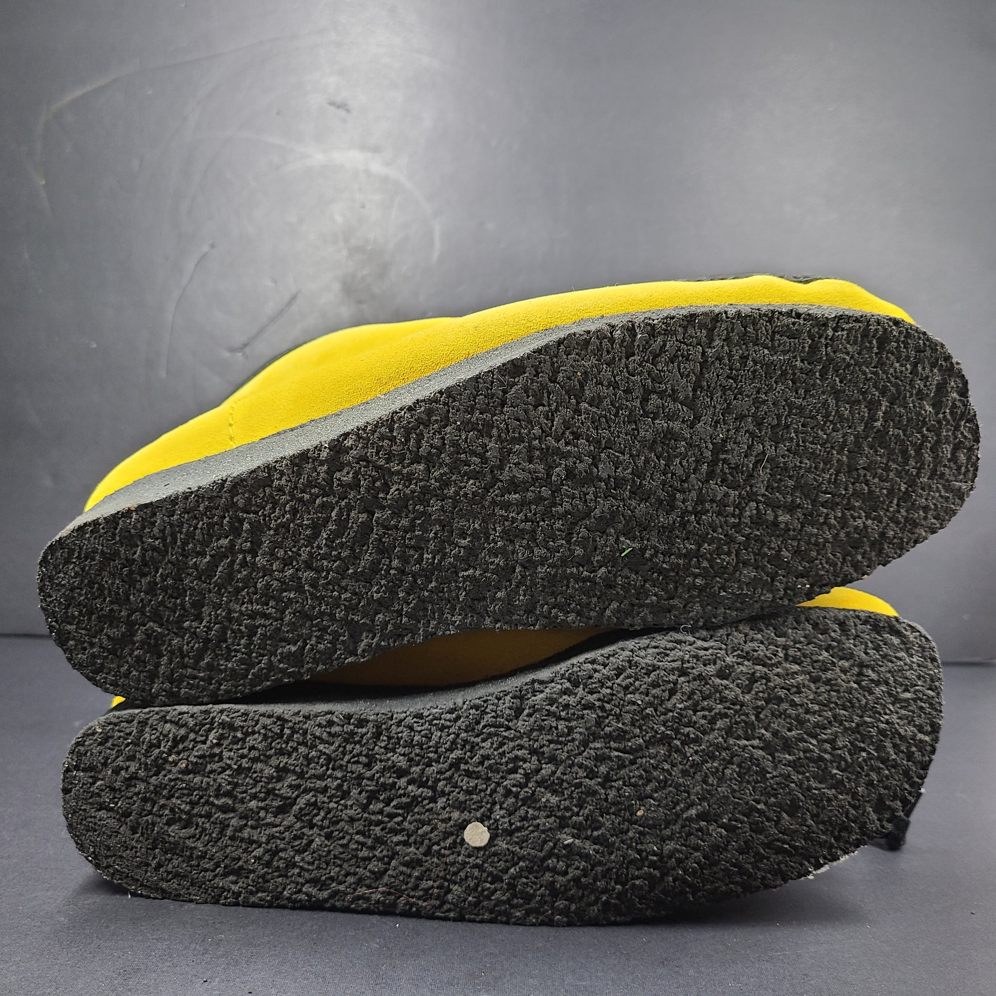 A pair of vibrant yellow Clarks Originals Jamaica Bee shoes.