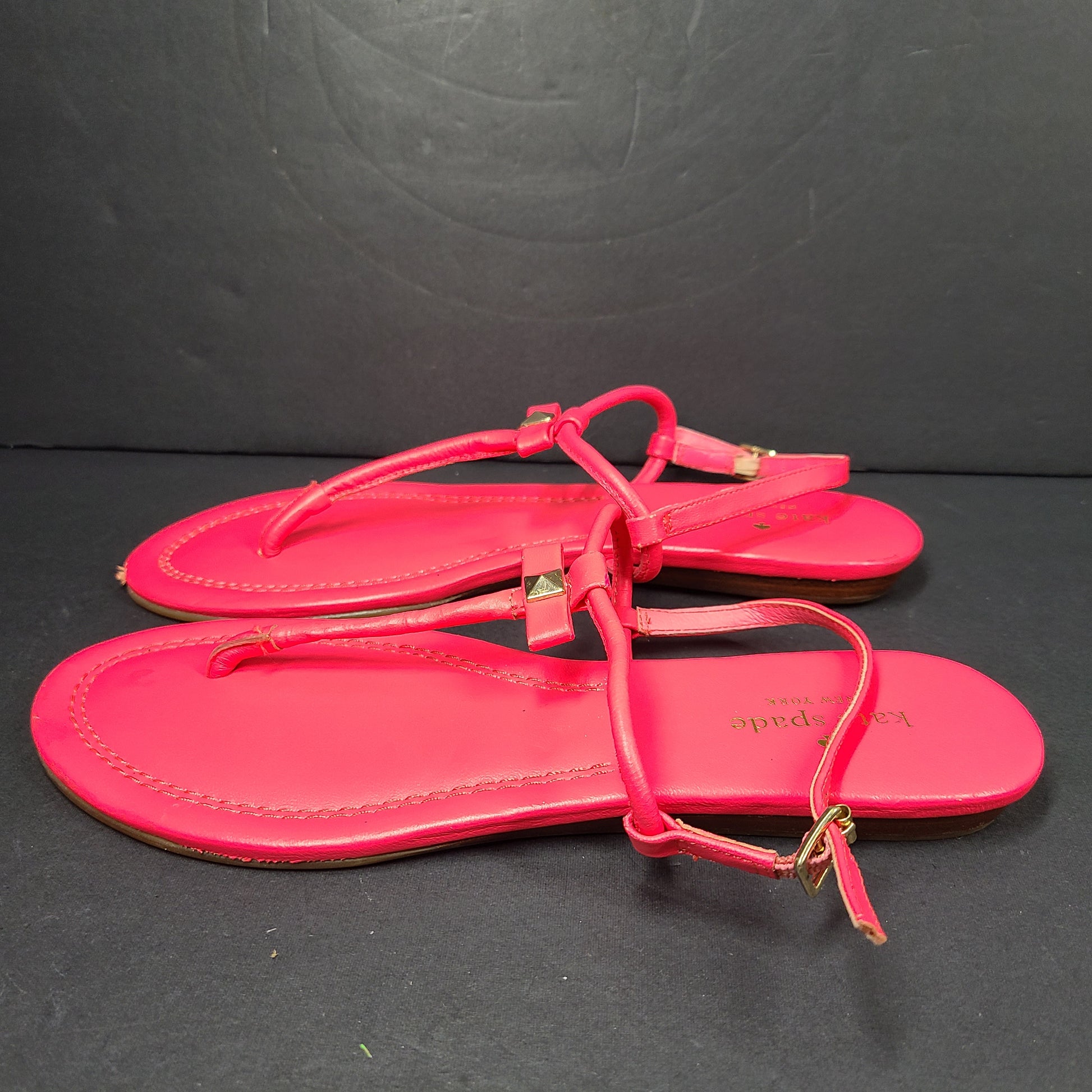 A pair of pink Kate Spade New York sandals