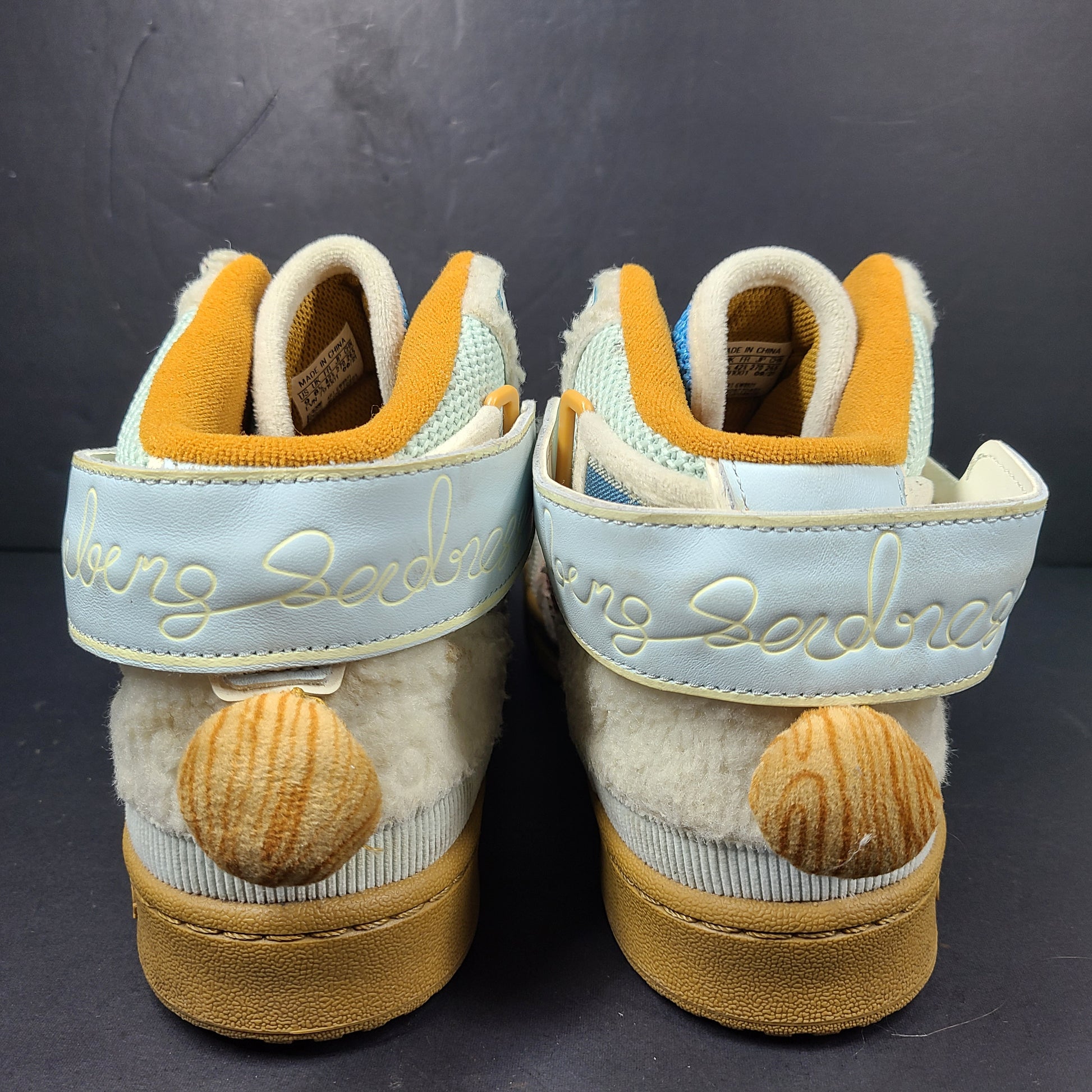 A pair of multicolor Adidas sneakers with artistic design