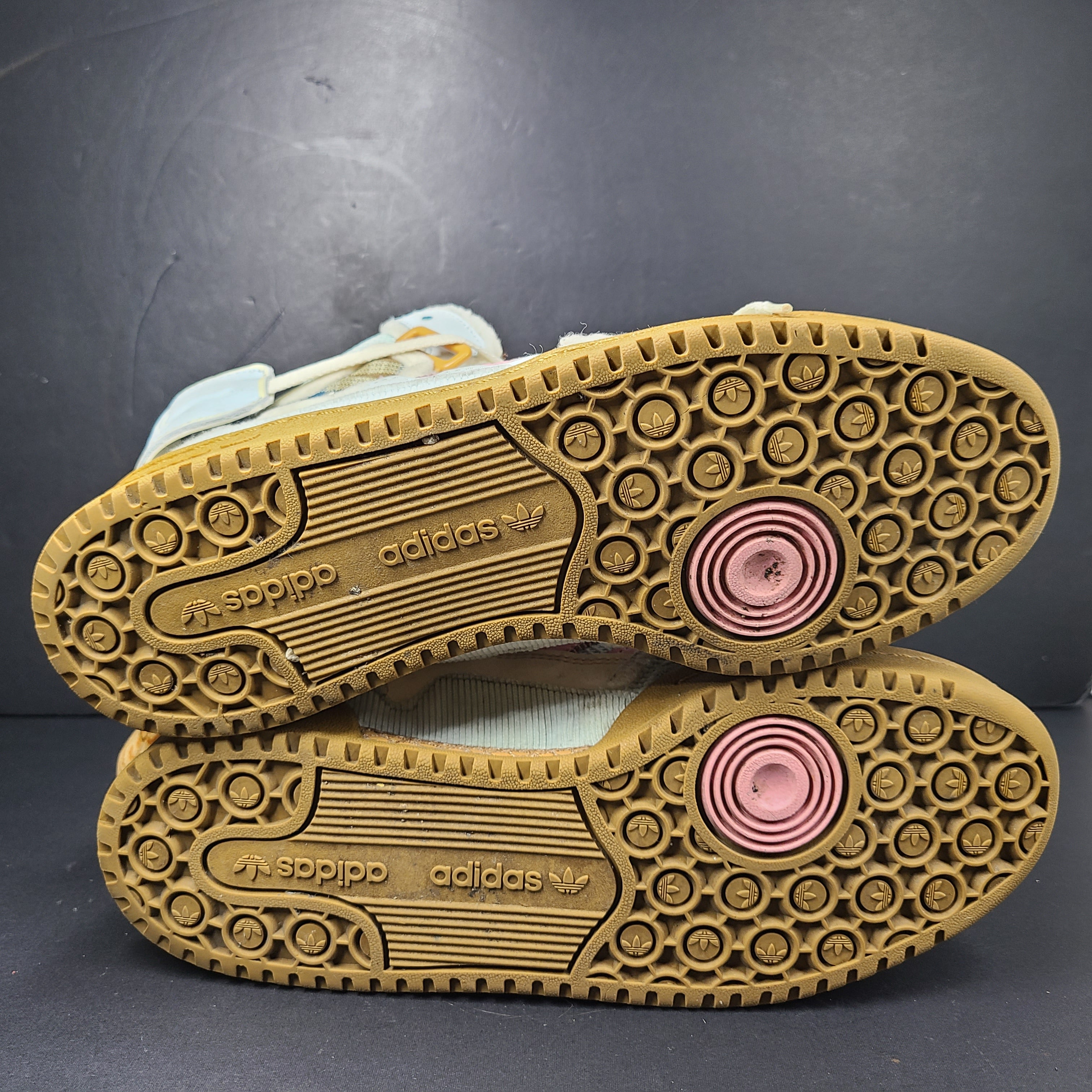 A pair of multicolor Adidas sneakers with artistic design