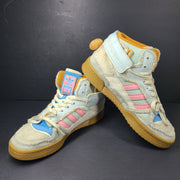 A pair of multicolor Adidas sneakers with artistic design