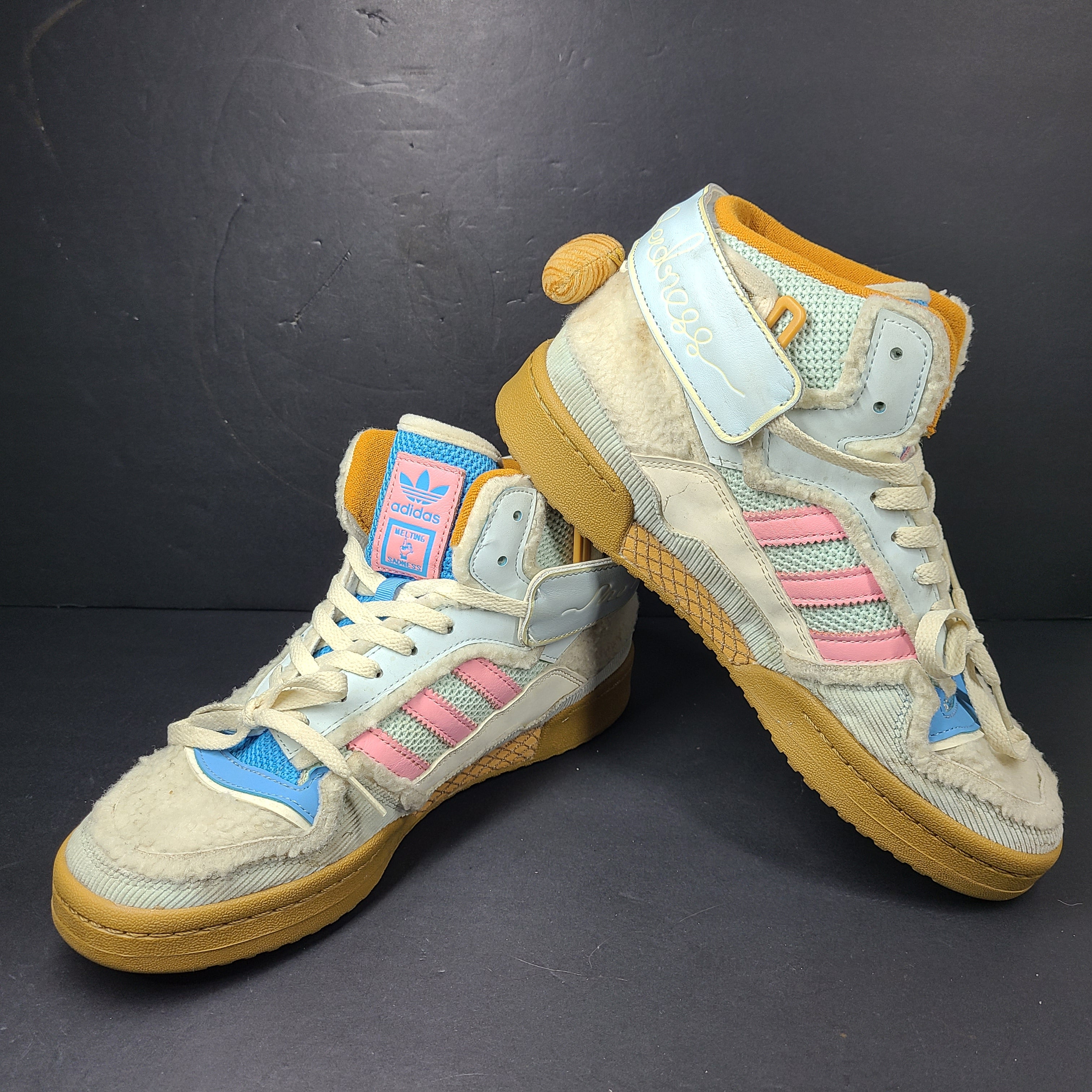 A pair of multicolor Adidas sneakers with artistic design