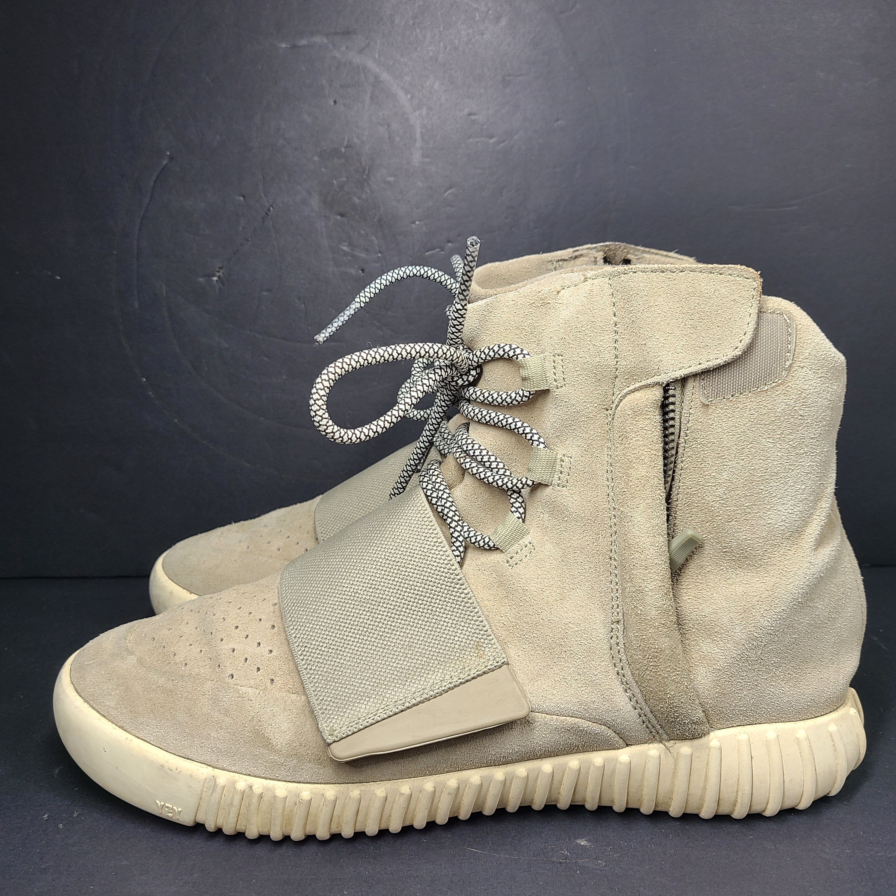 A pair of men's Adidas Yeezy Boost 750 Light Brown sneakers in size 11.