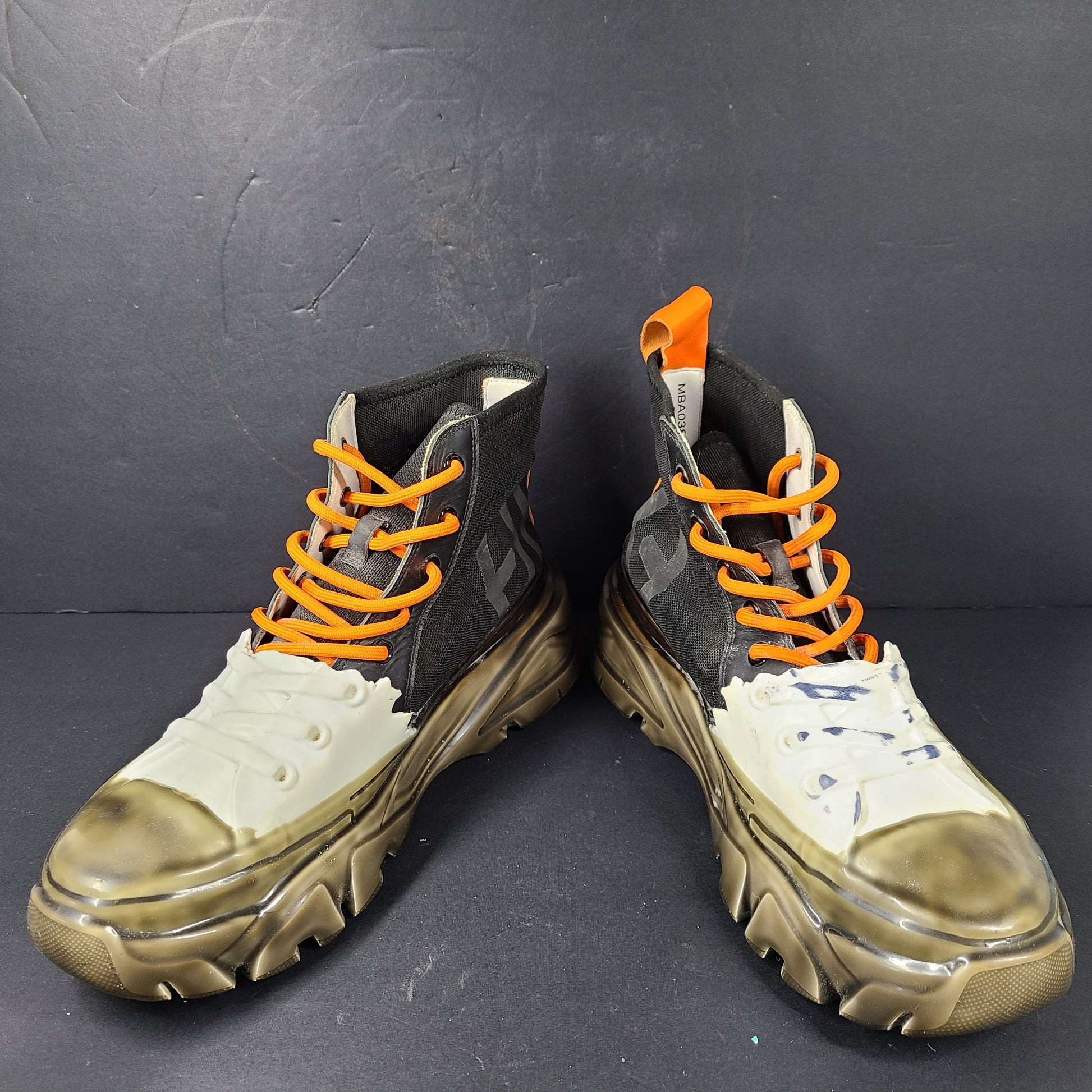 A pair of black and orange high top sneakers with Sz 41 for men.