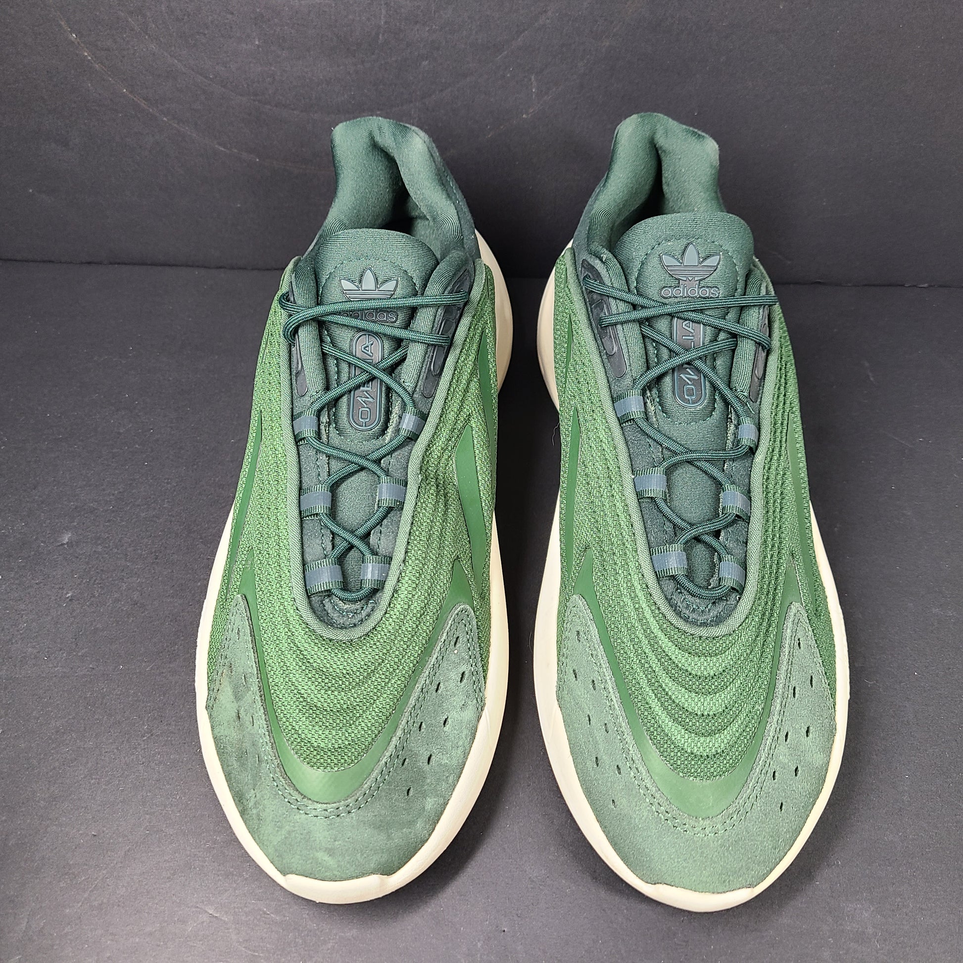 A pair of green Adidas Adiprene sneakers in size 9.5