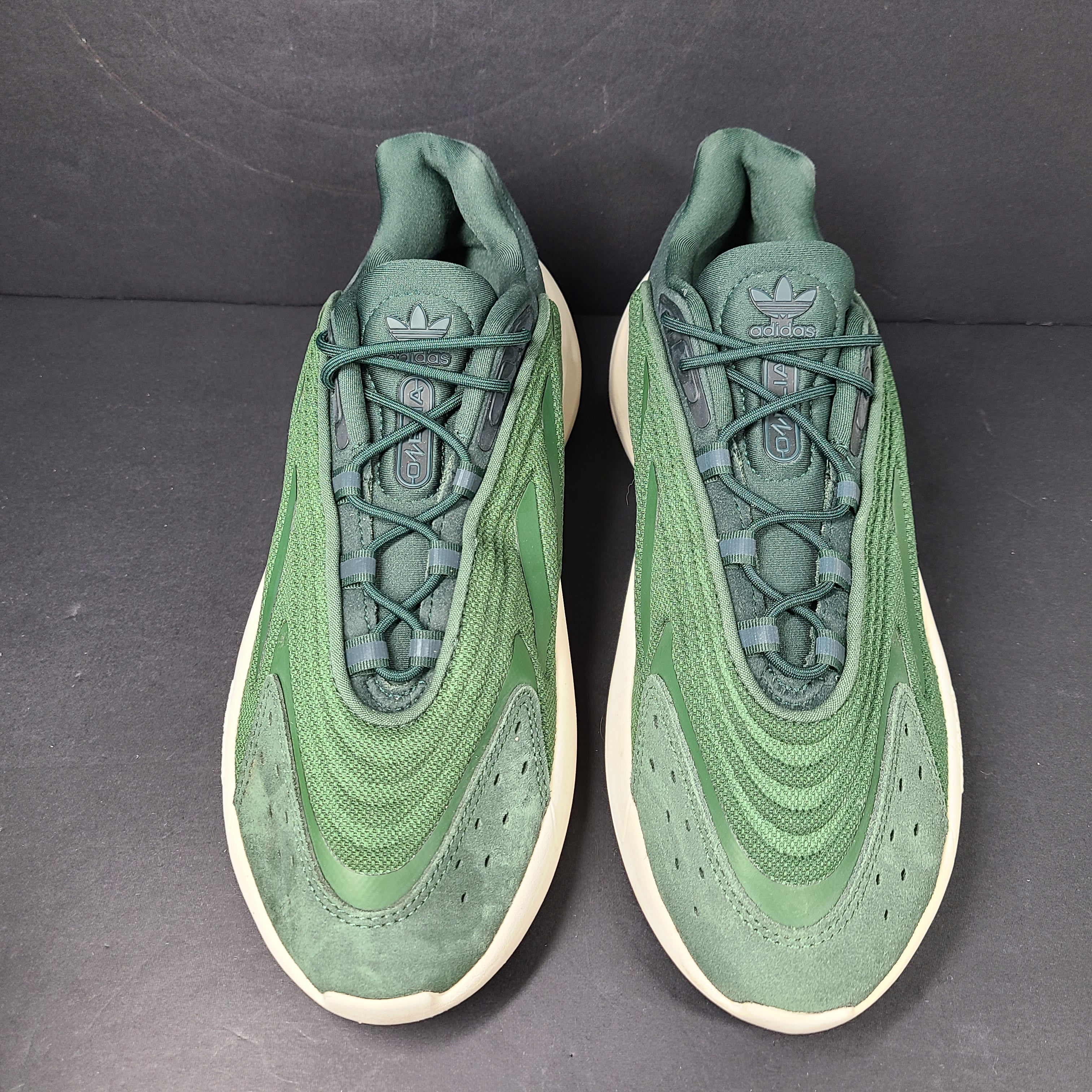 A pair of green Adidas Adiprene sneakers in size 9.5