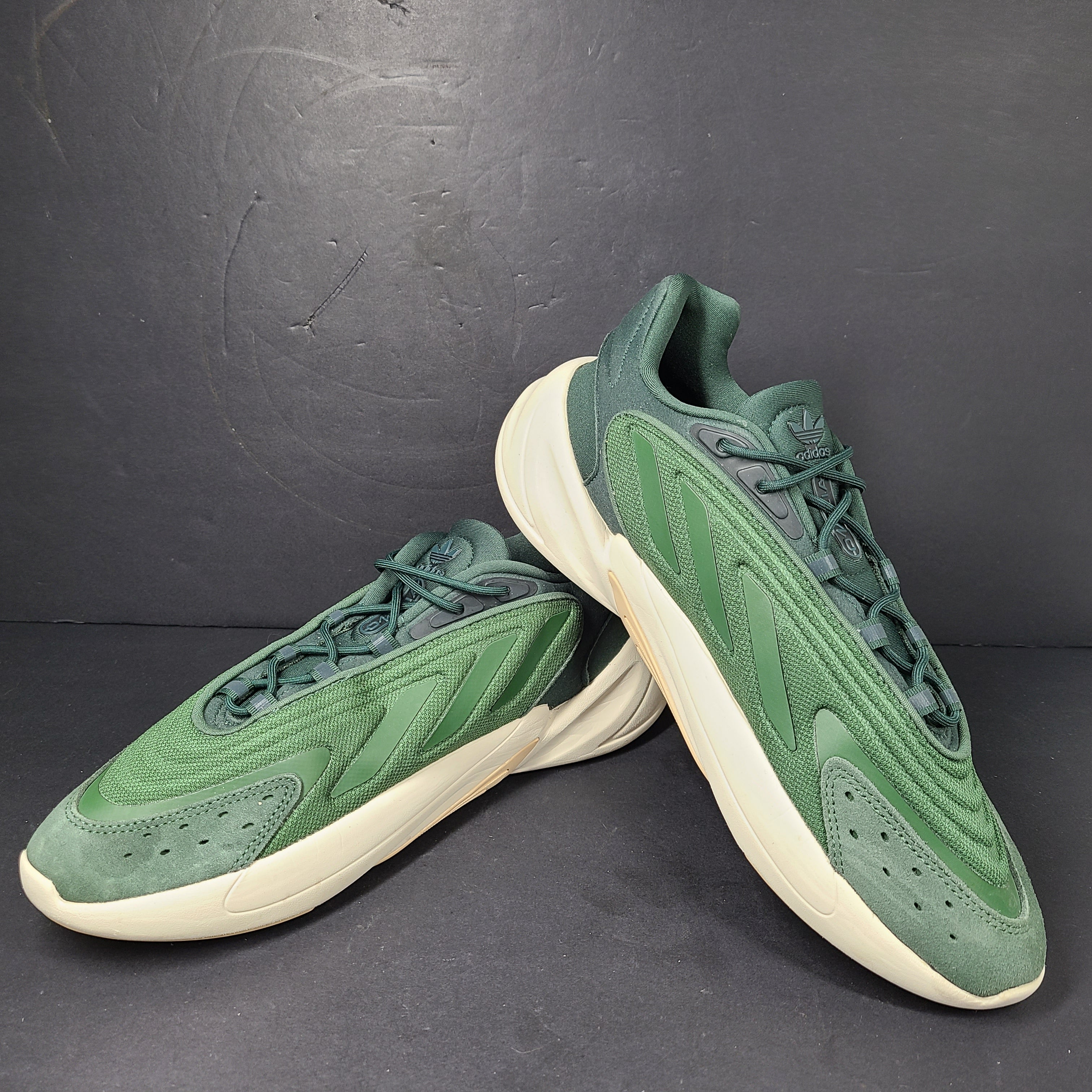A pair of green Adidas Adiprene sneakers in size 9.5