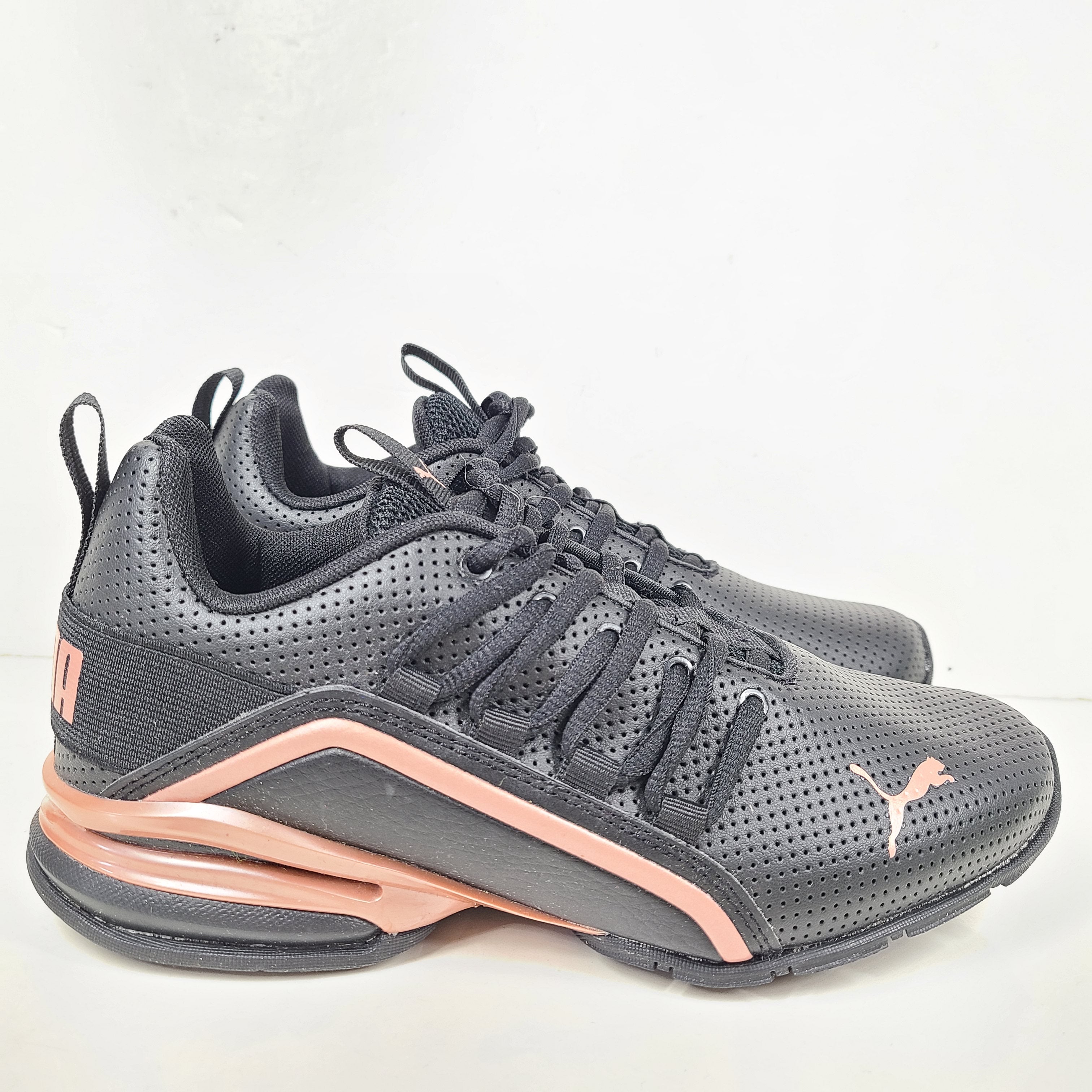A pair of black and pink Puma Women's Training Shoes