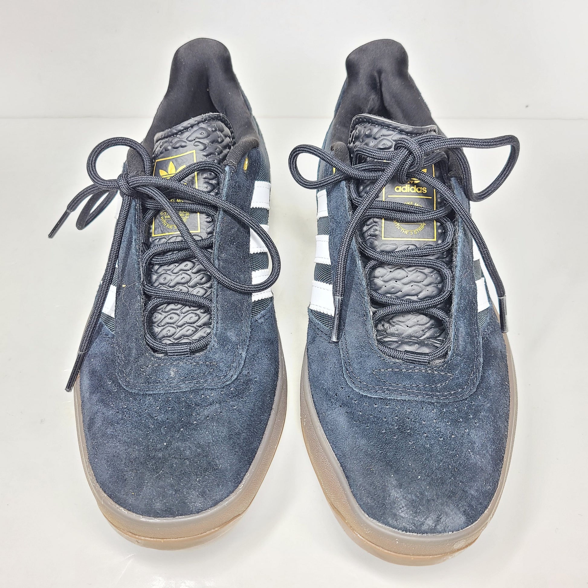 A pair of black Adidas Originals sneakers with model number FV5932.