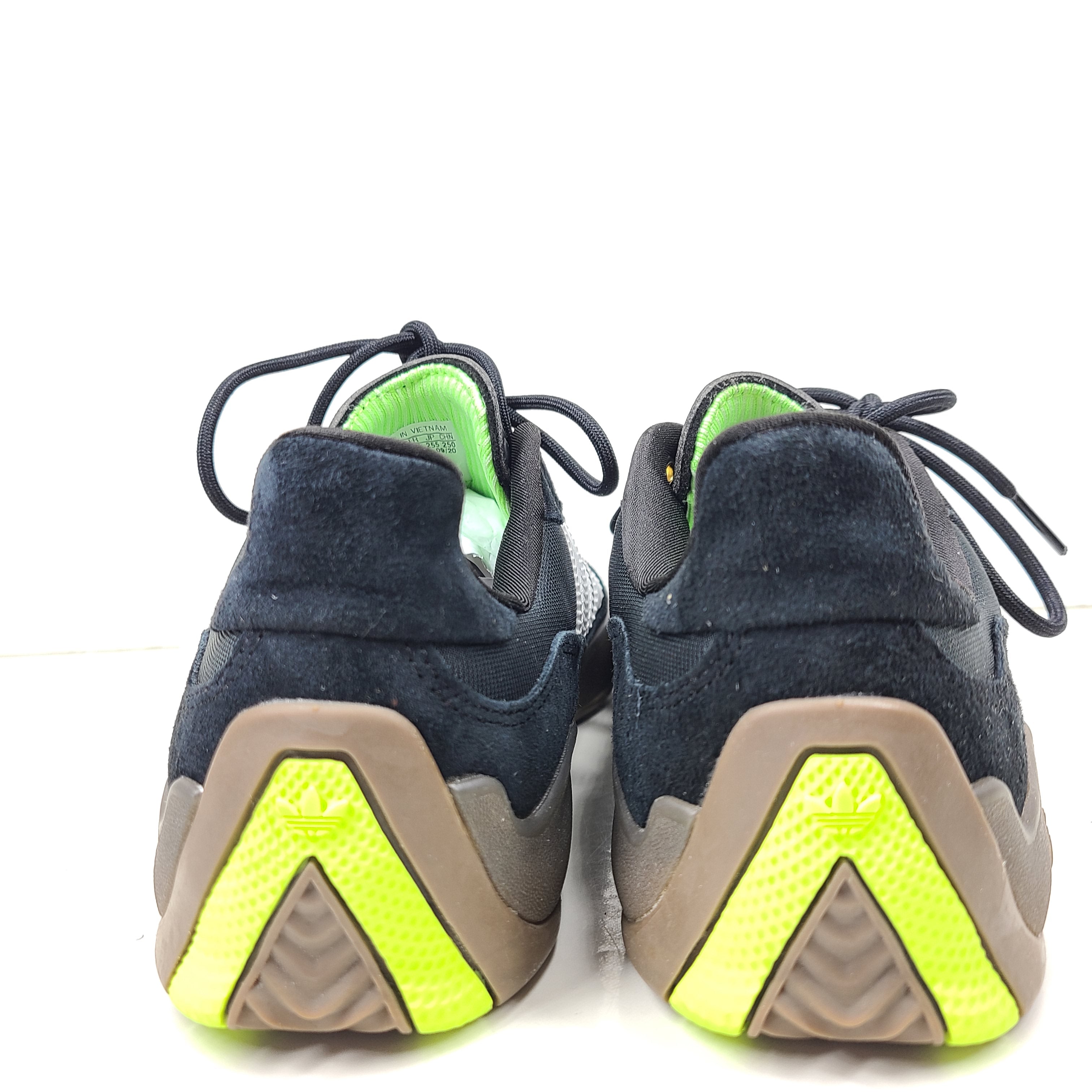 A pair of black Adidas Originals sneakers with model number FV5932.