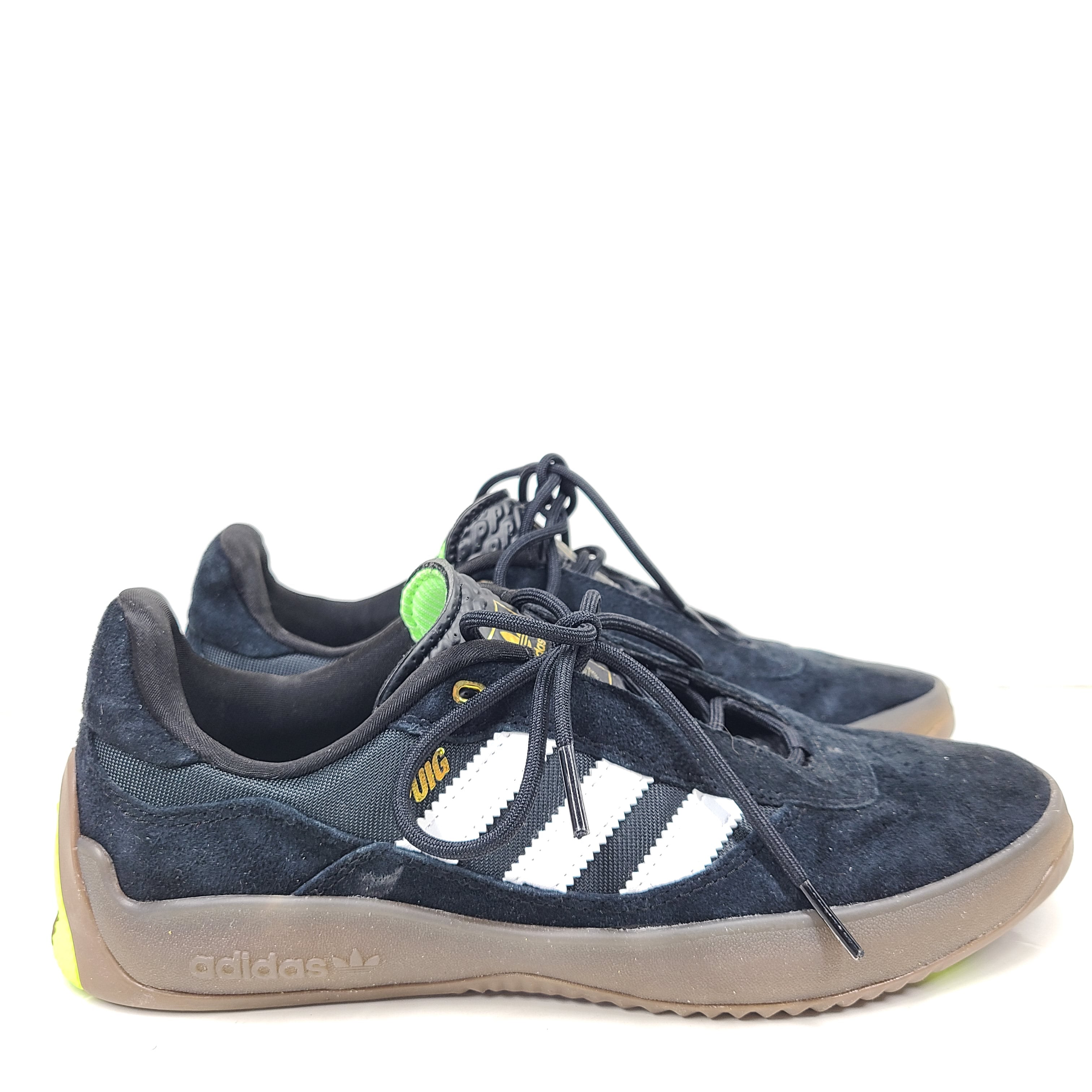 A pair of black Adidas Originals sneakers with model number FV5932.
