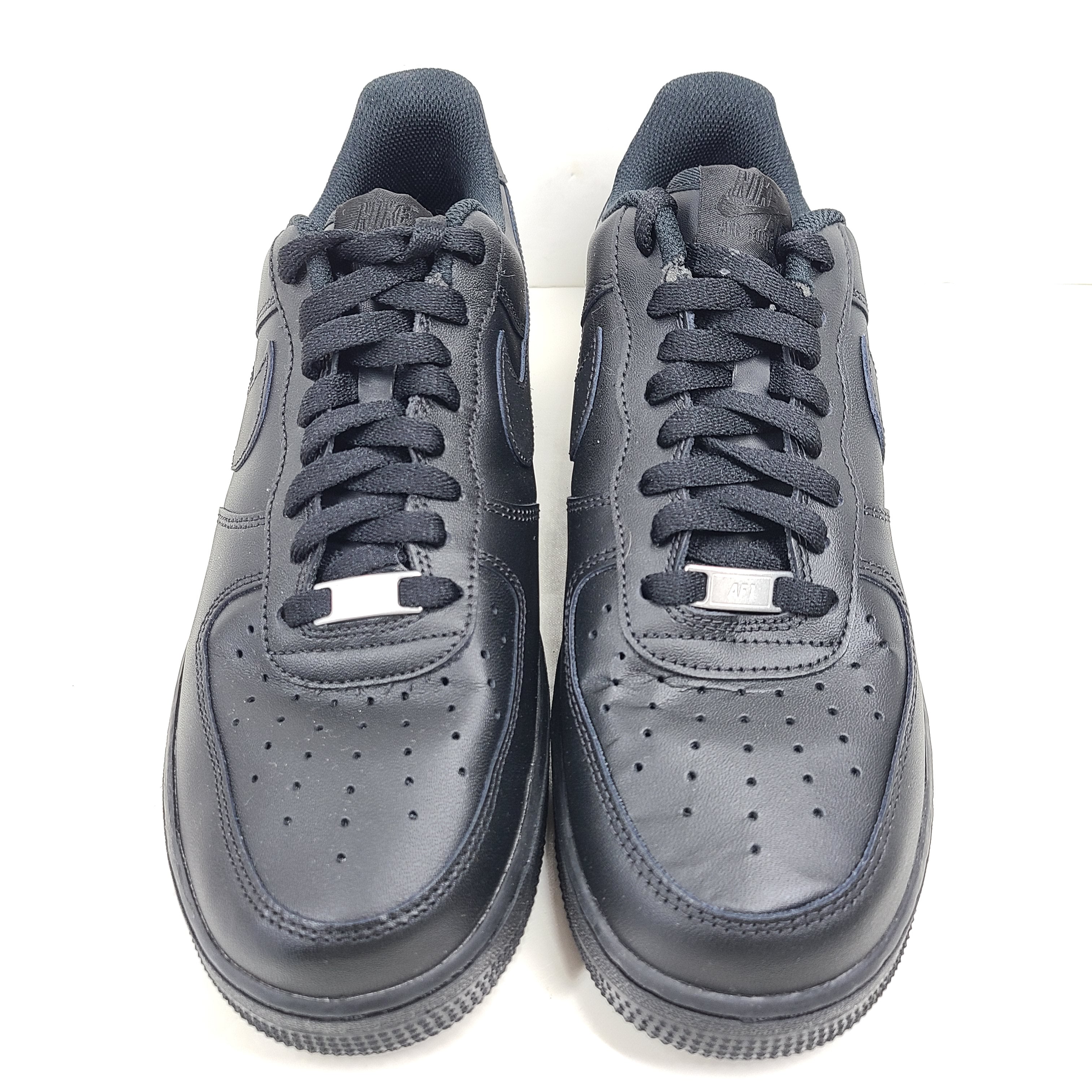 A pair of black Nike Air Force 1 Low sneakers for men