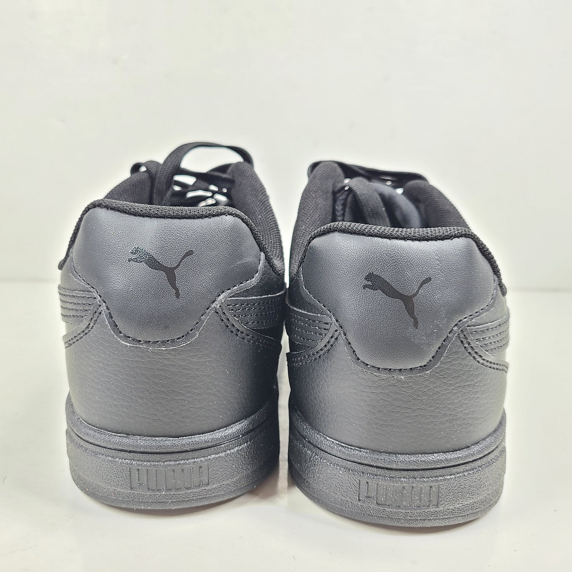 A pair of black men's Puma SoftFoam shoes