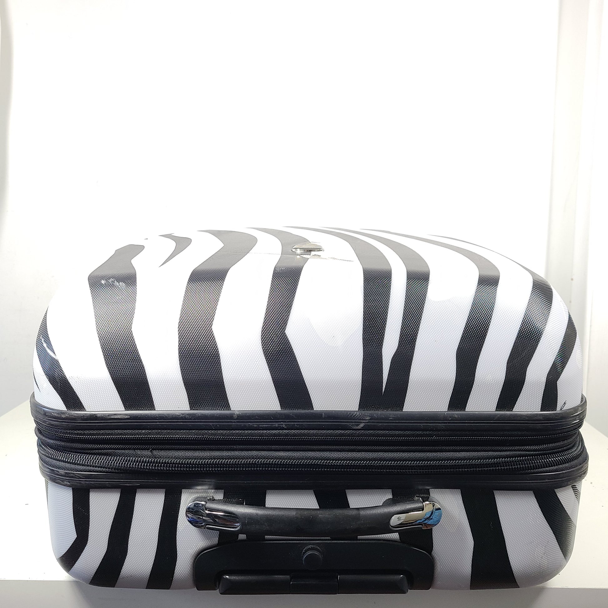 A stylish zebra-print hard shell luggage by Heys