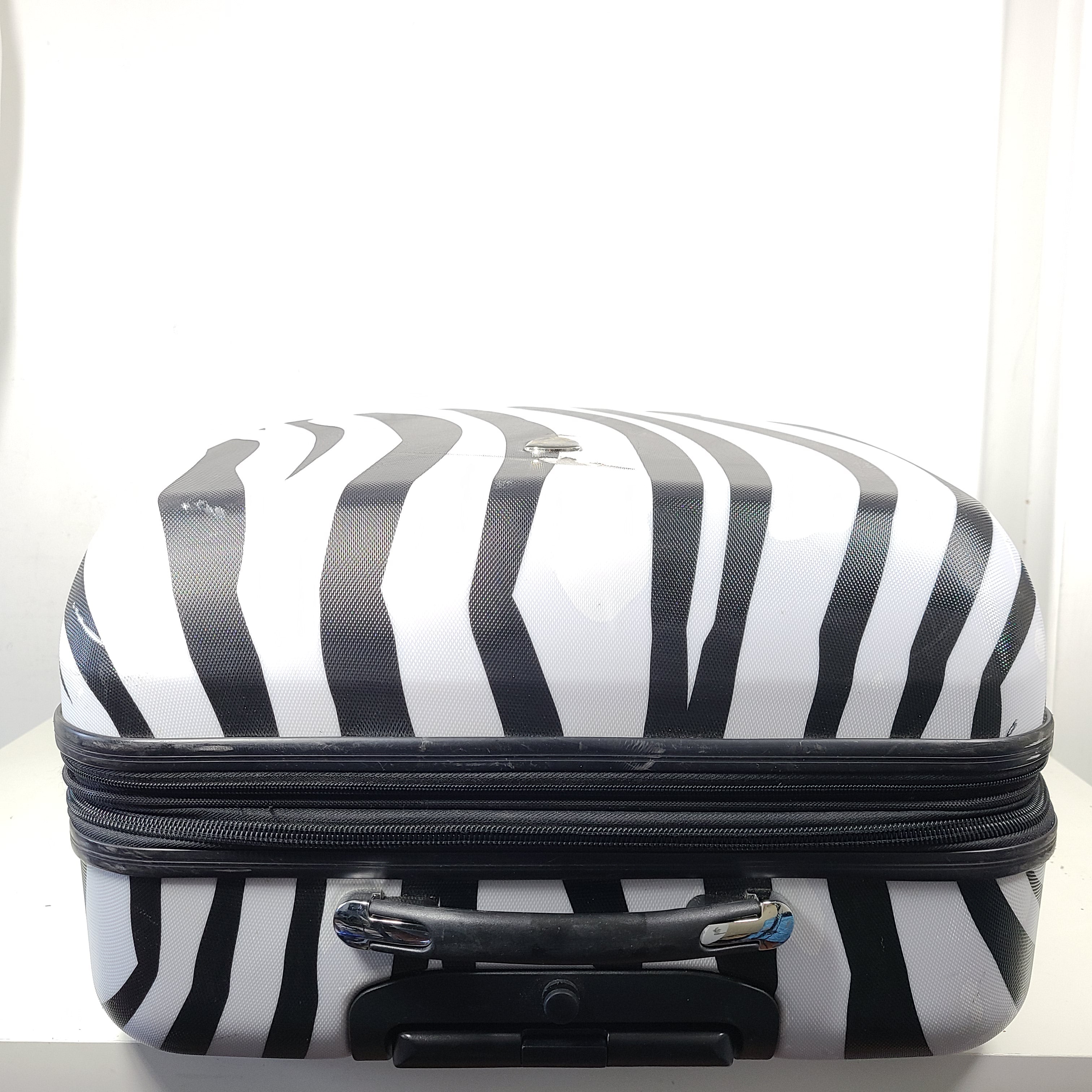 A stylish zebra-print hard shell luggage by Heys