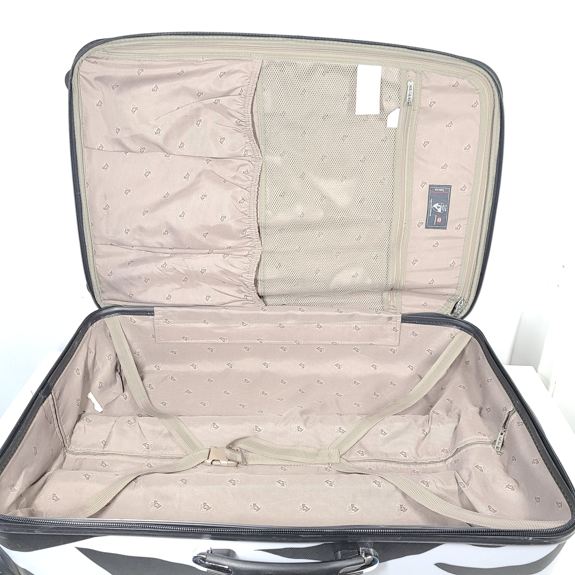 A stylish zebra-print hard shell luggage by Heys