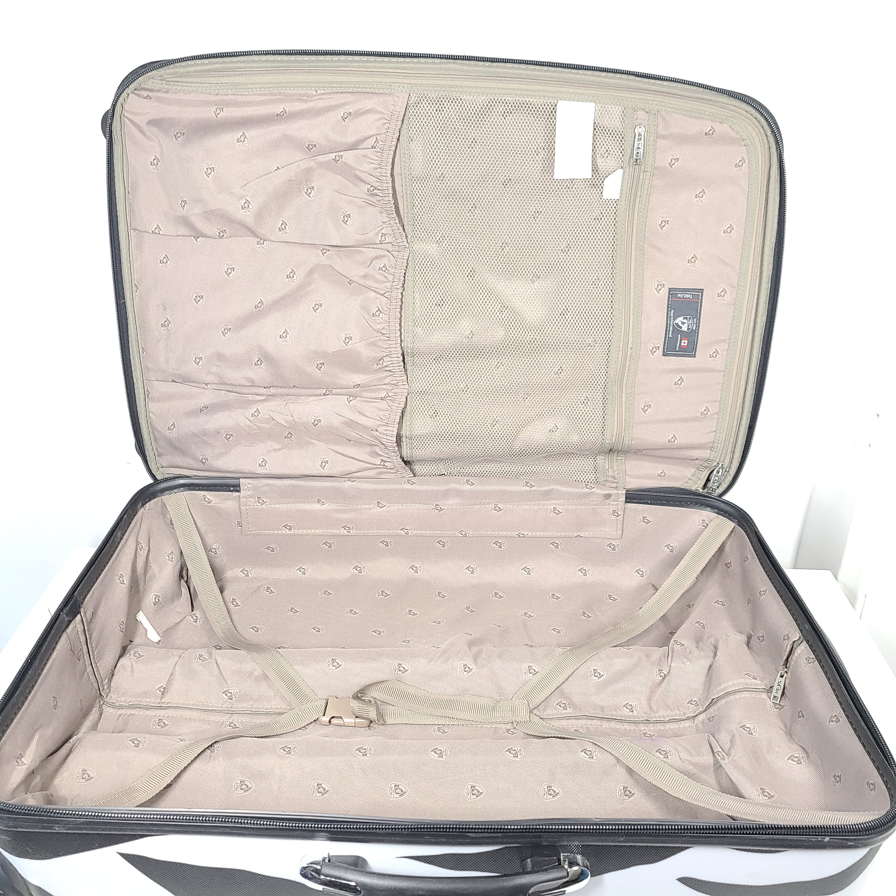 A stylish zebra-print hard shell luggage by Heys