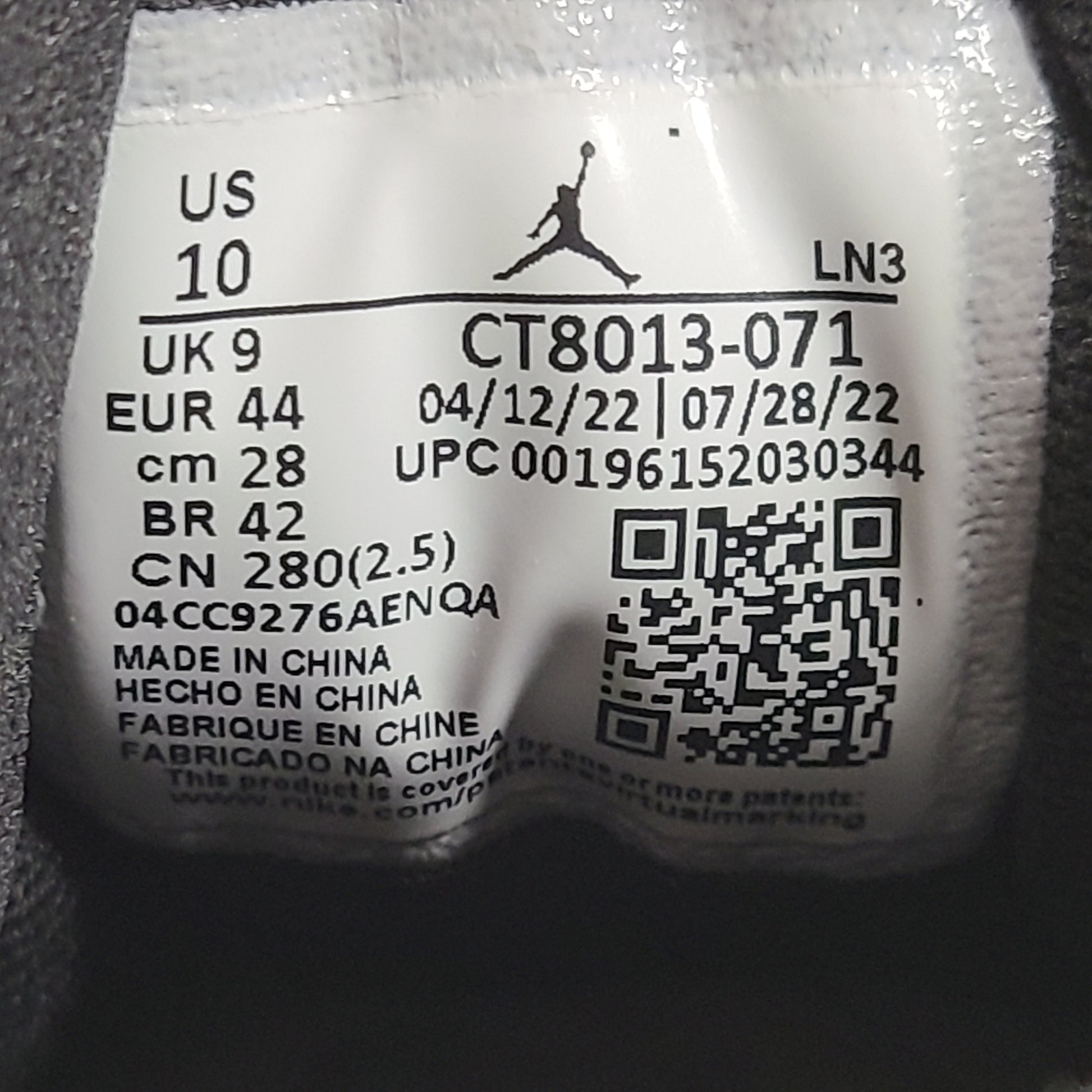 A pair of black and yellow Nike Air Jordan 12 Retro sneakers
