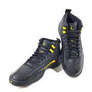 A pair of black and yellow Nike Air Jordan 12 Retro sneakers