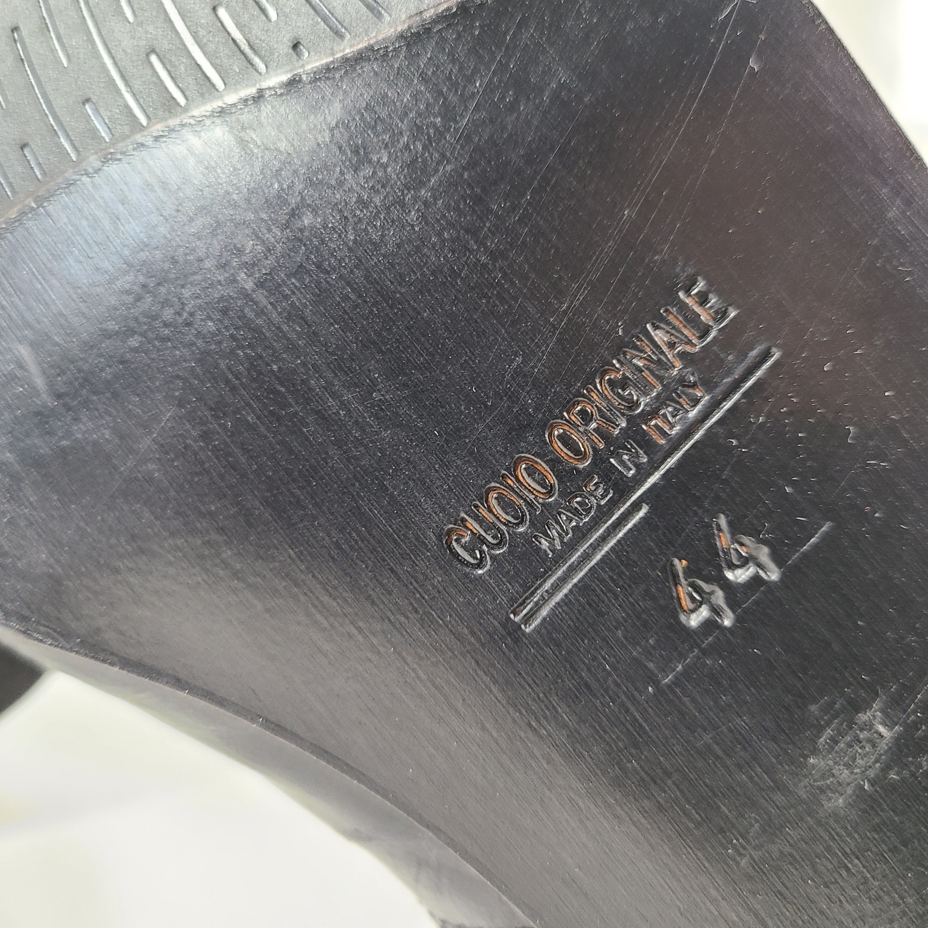 A pair of black leather Chelsea boots for men, size 44.