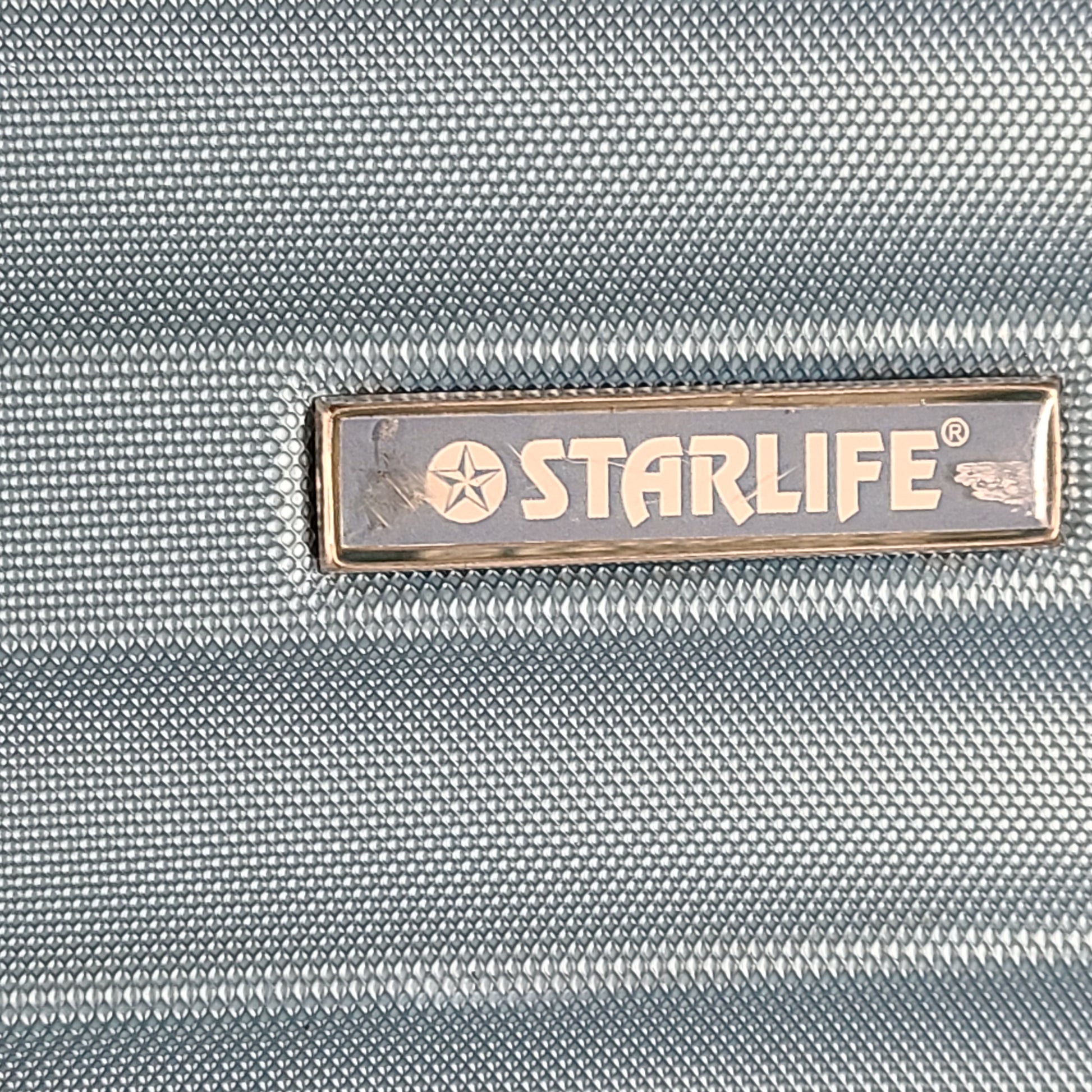 A versatile blue hard-shell suitcase with spinner wheels.