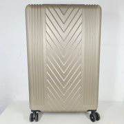 A stylish gold BCBGeneration suitcase made of 100% ABS material.