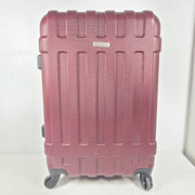 A burgundy Samsonite hardside spinner suitcase