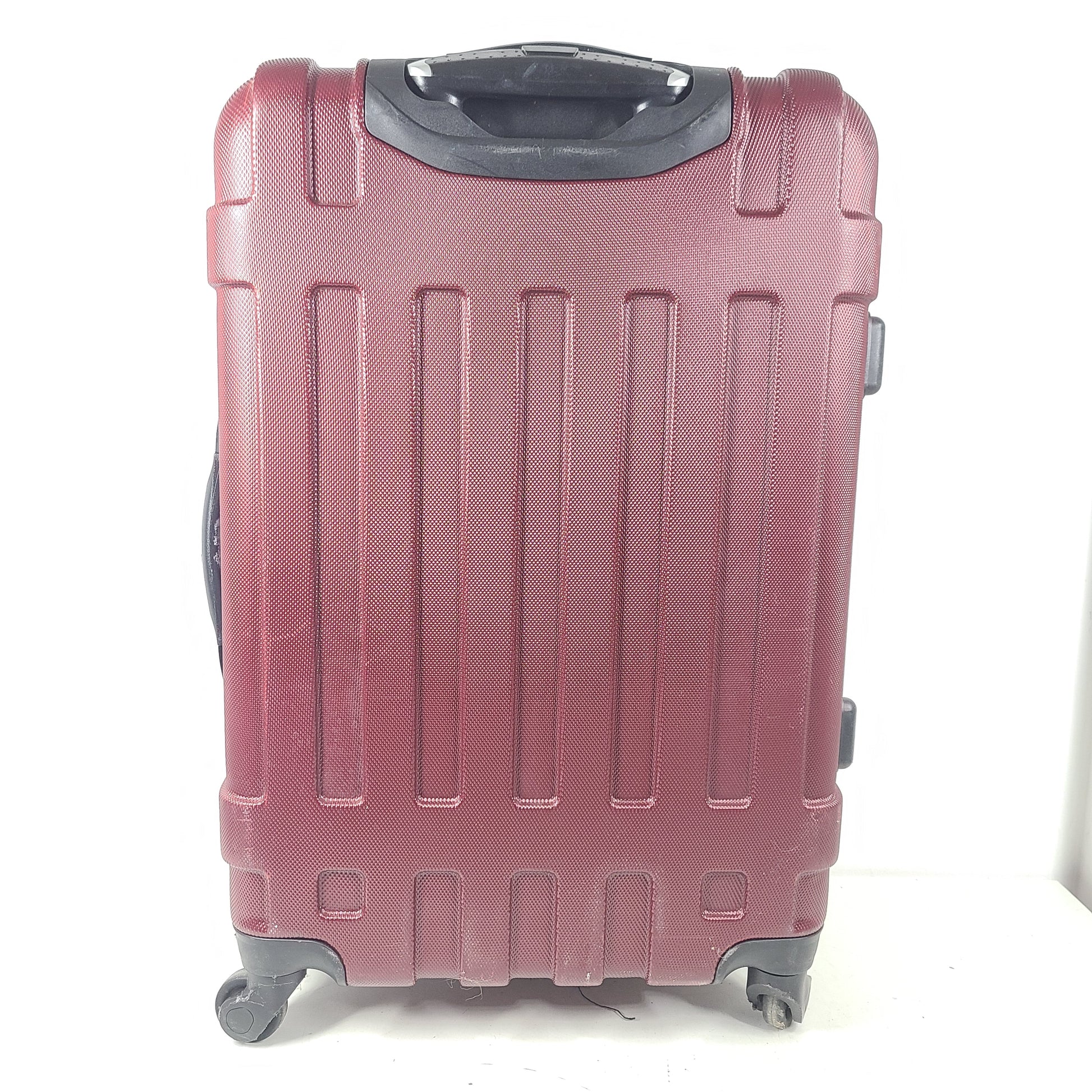 A burgundy Samsonite hardside spinner suitcase