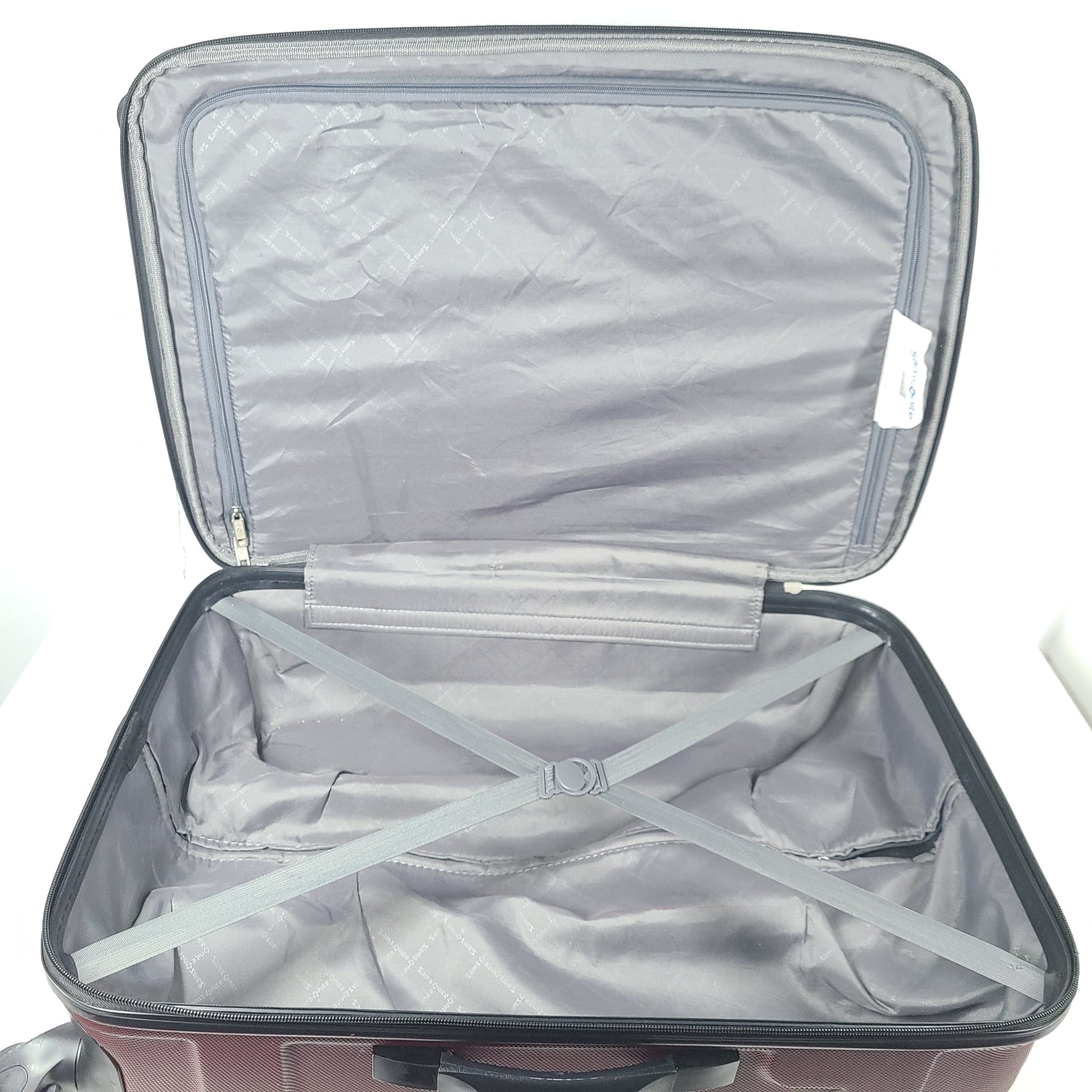 A burgundy Samsonite hardside spinner suitcase