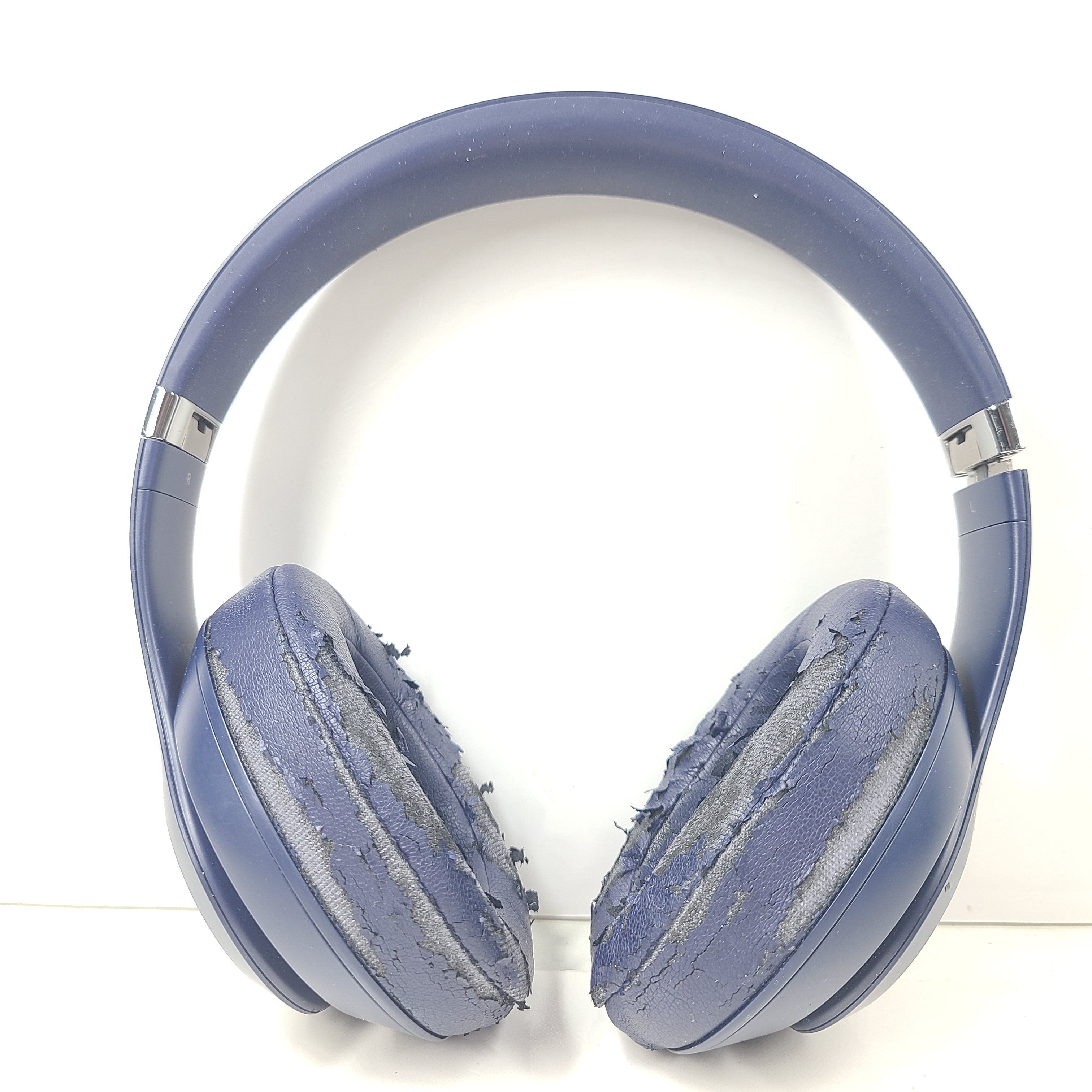 A pair of blue Beats wireless headphones.