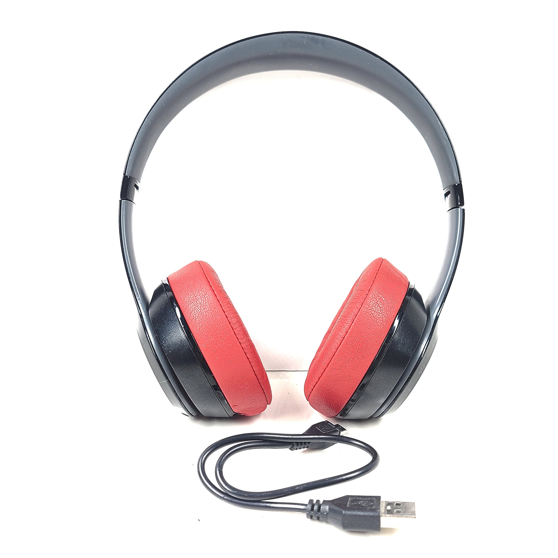 A pair of Beats Solo Wireless Headphones in red and black design