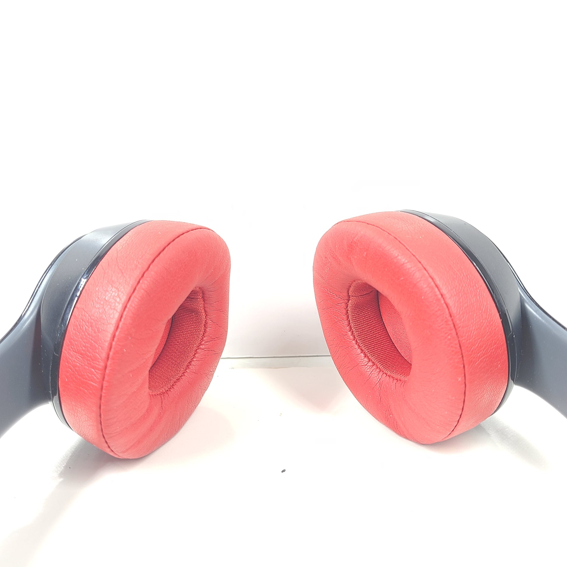 A pair of Beats Solo Wireless Headphones in red and black design