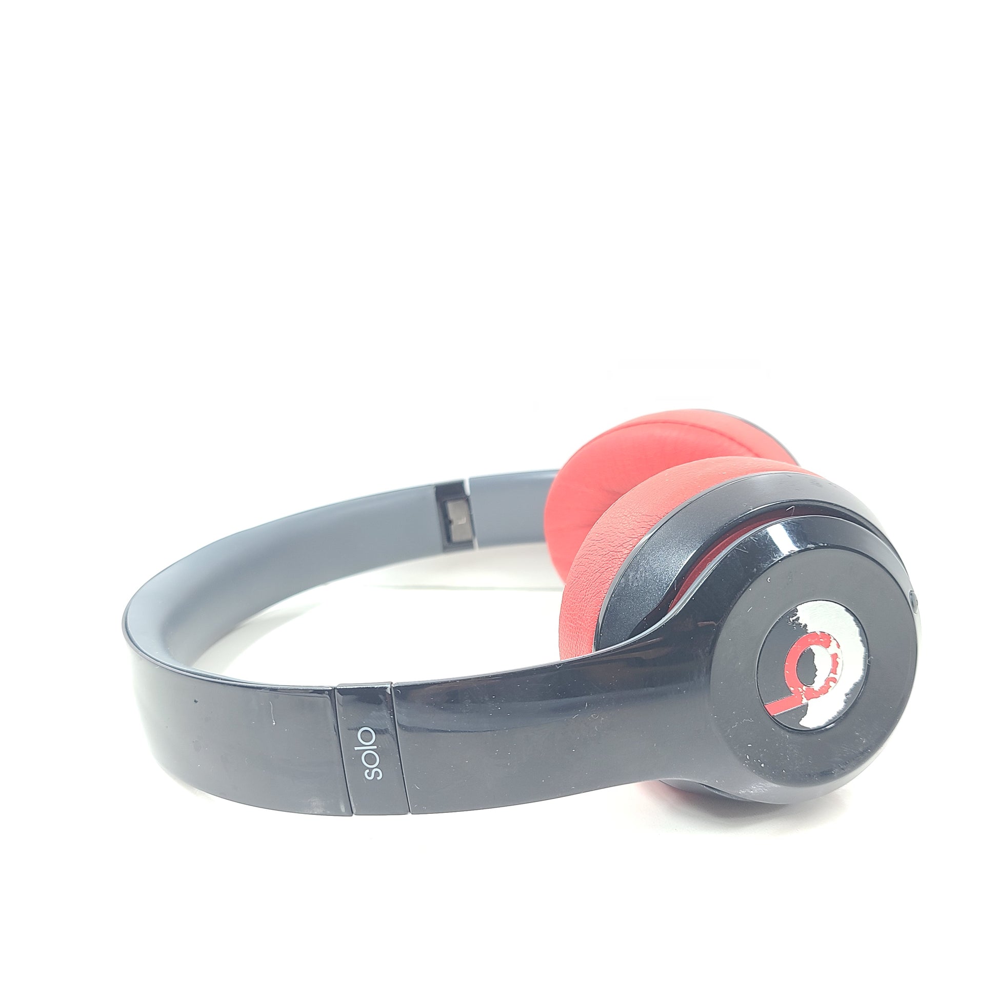 A pair of Beats Solo Wireless Headphones in red and black design