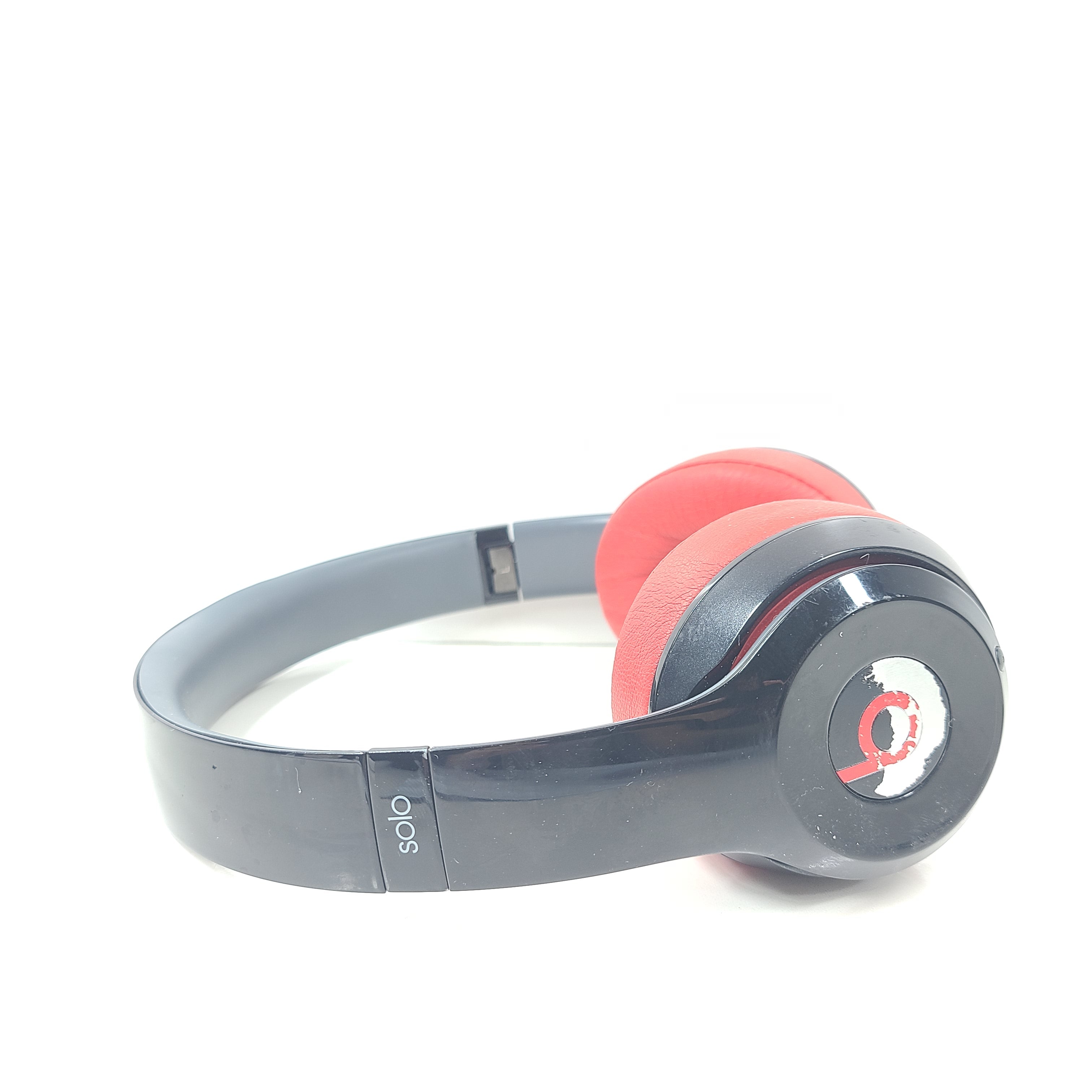 A pair of Beats Solo Wireless Headphones in red and black design