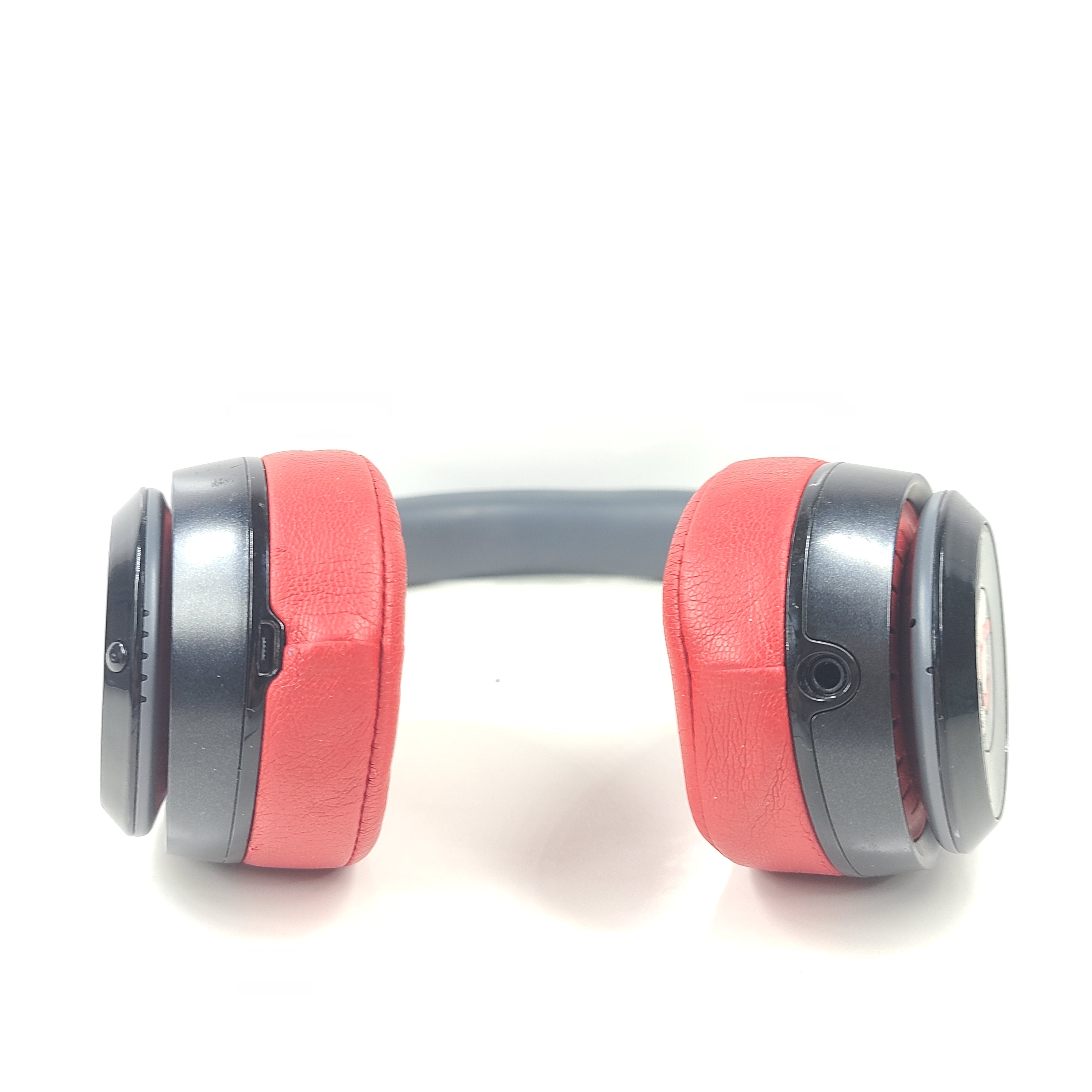 A pair of Beats Solo Wireless Headphones in red and black design