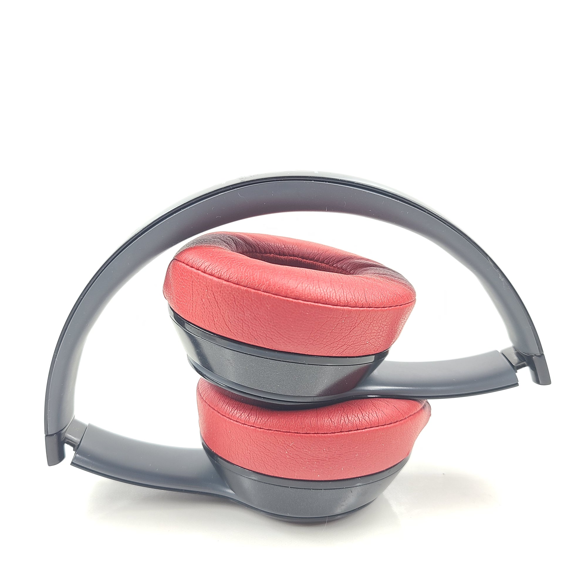 A pair of Beats Solo Wireless Headphones in red and black design