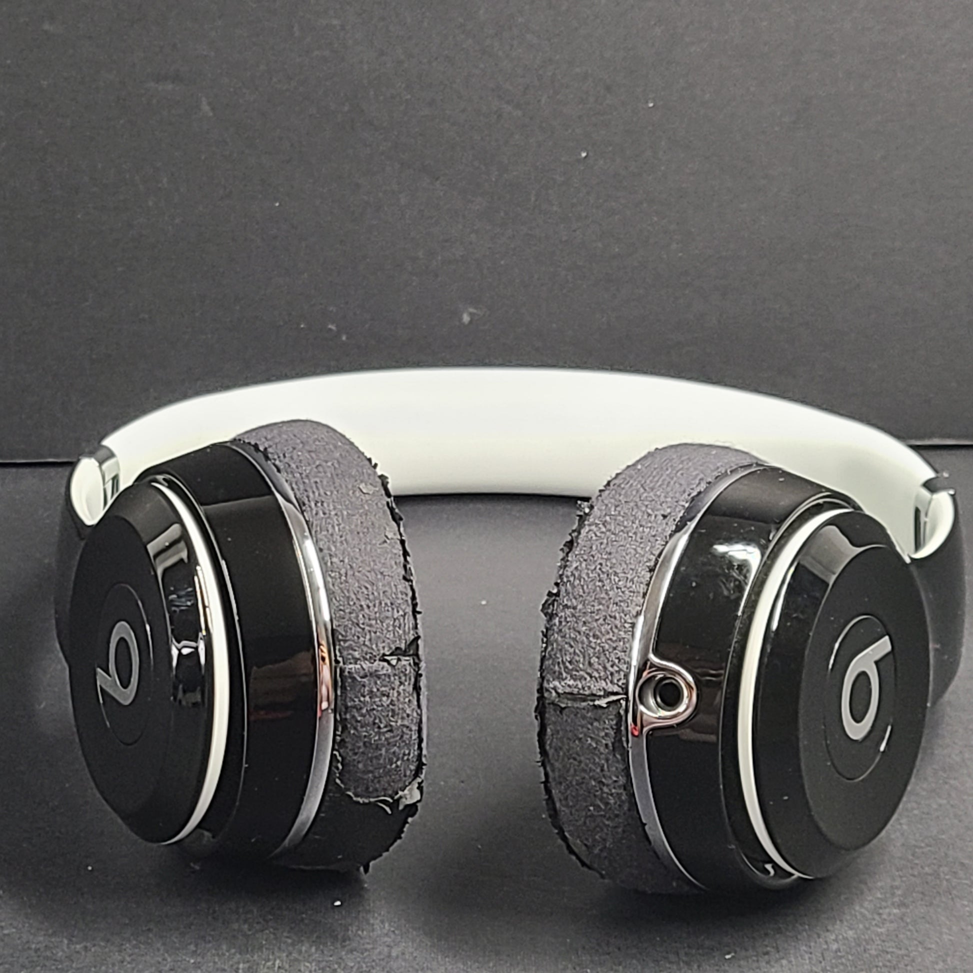 A pair of Beats Solo Wired Headphones with a red cable