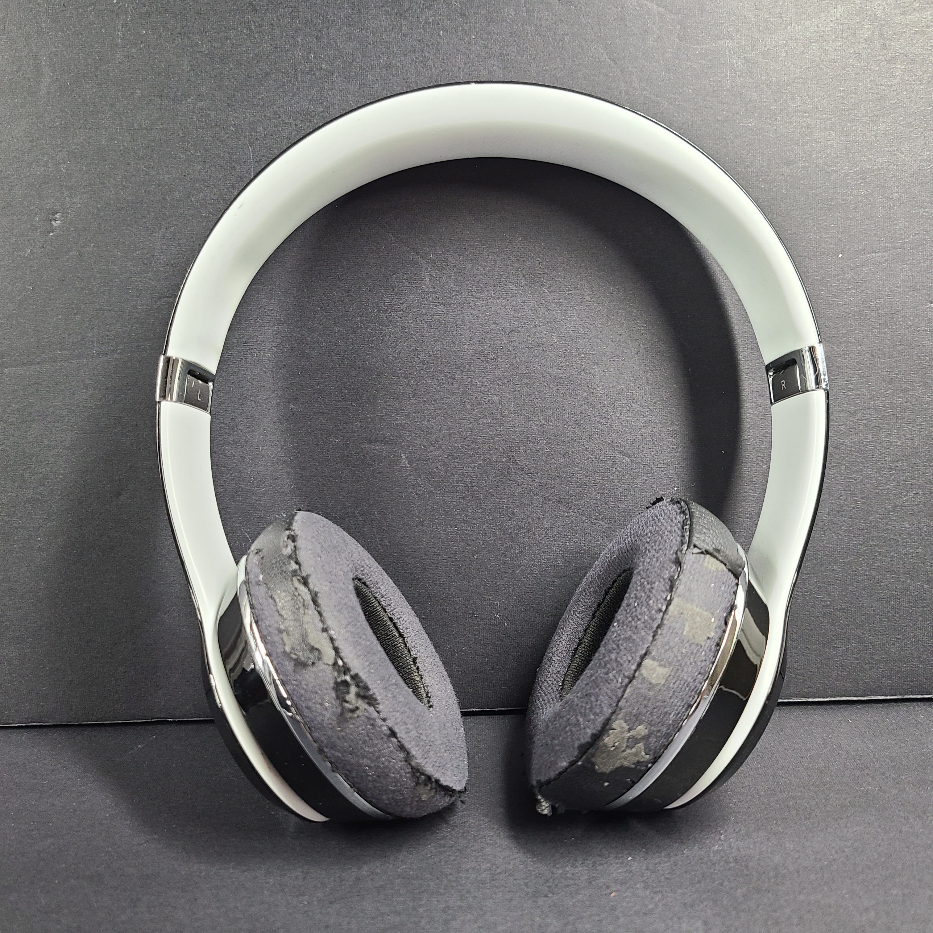 A pair of Beats Solo Wired Headphones with a red cable