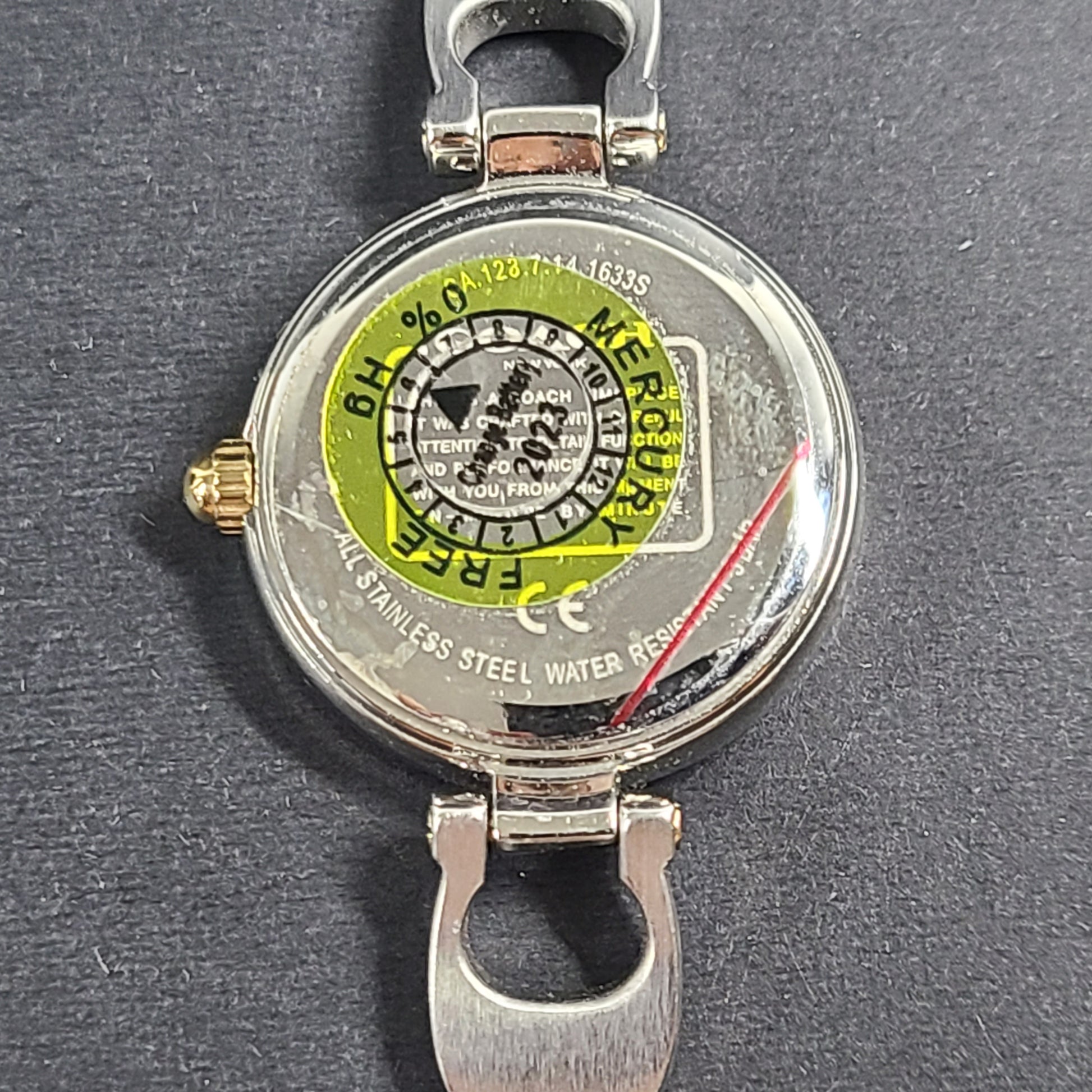 A stylish Coach women's stainless steel watch with model number 1633S.