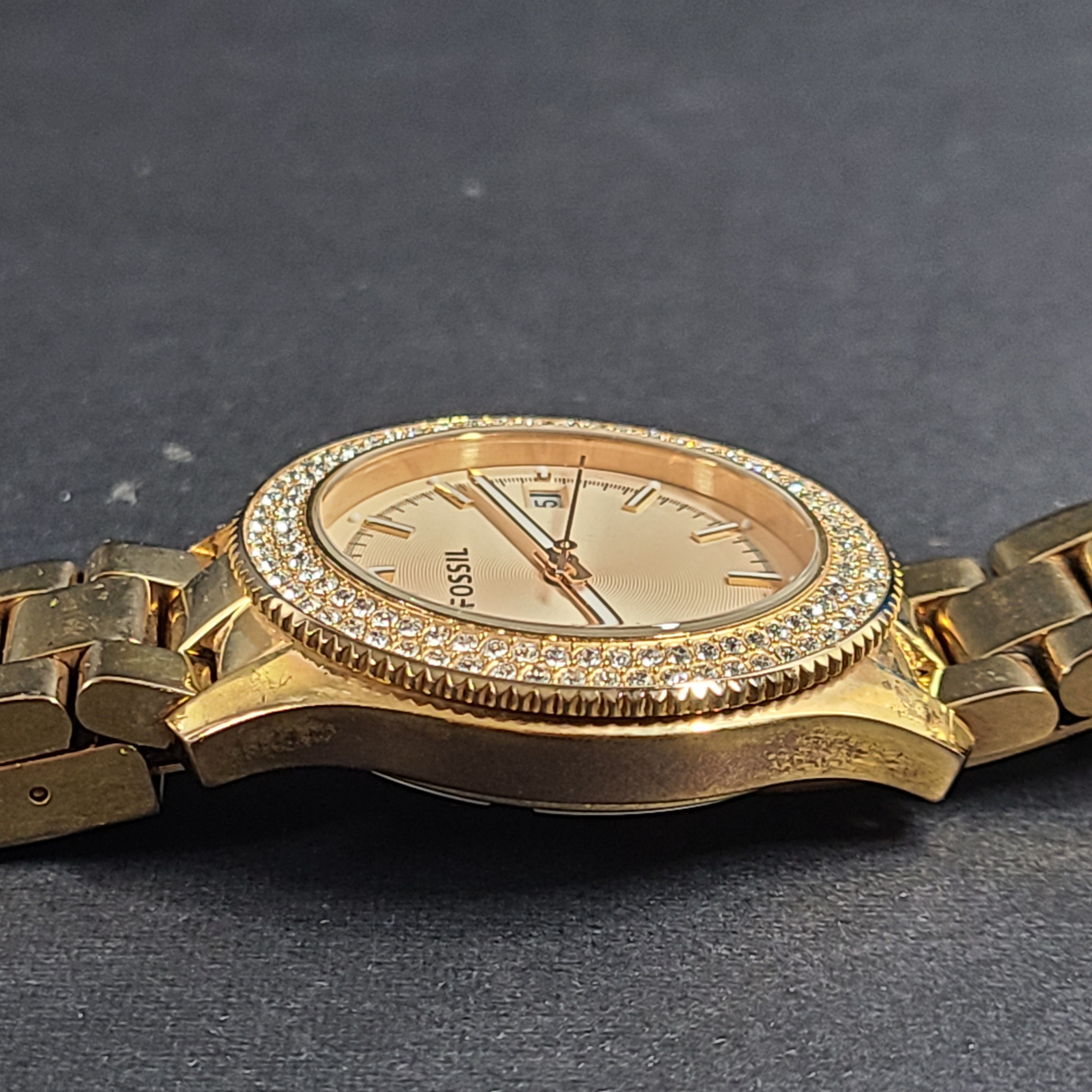 A stylish Fossil Analog Women's Watch with gold tones and crystal accents