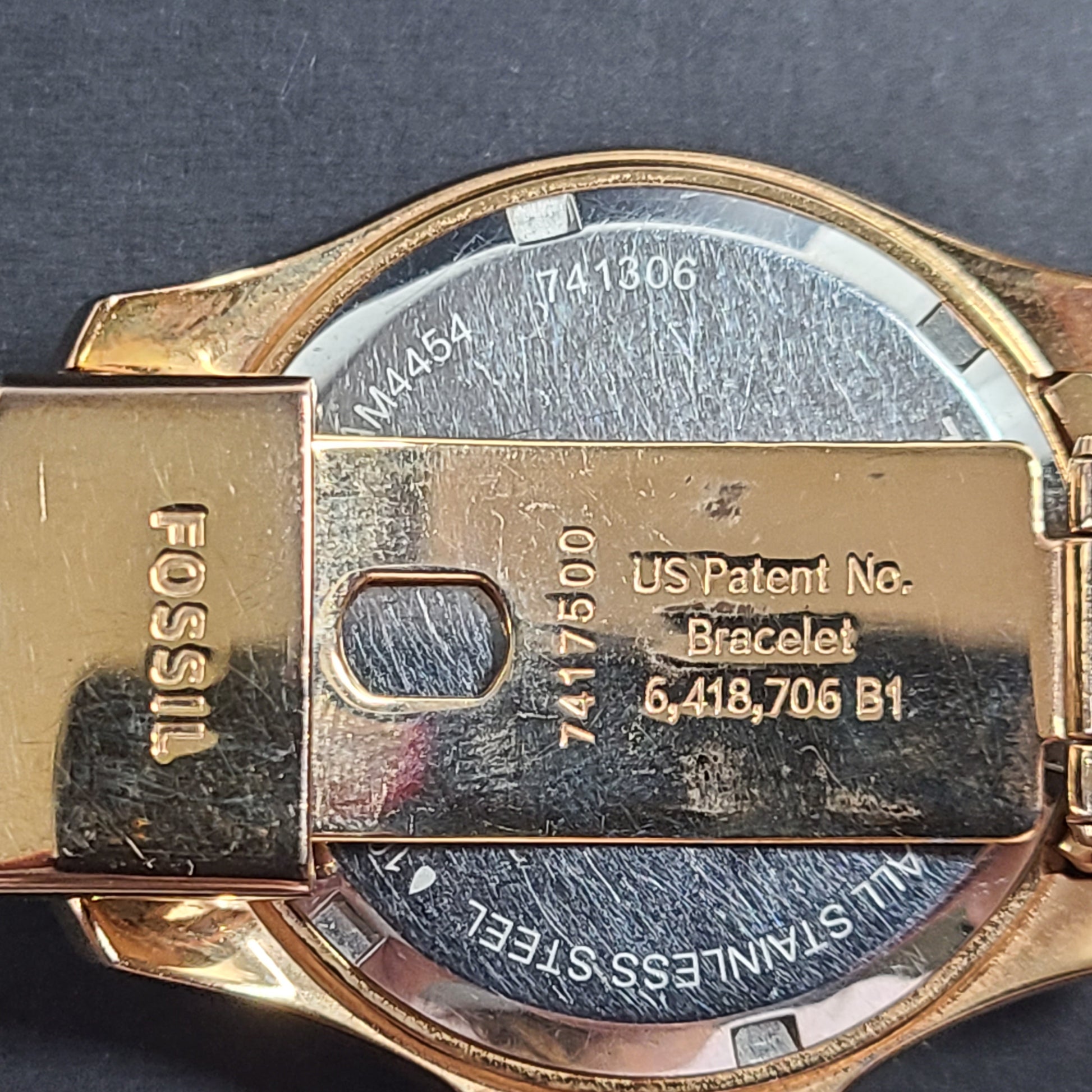 A stylish Fossil Analog Women's Watch with gold tones and crystal accents