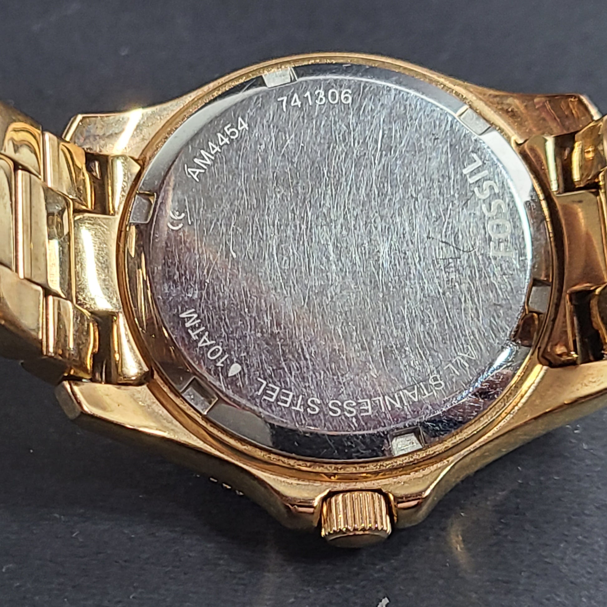 A stylish Fossil Analog Women's Watch with gold tones and crystal accents